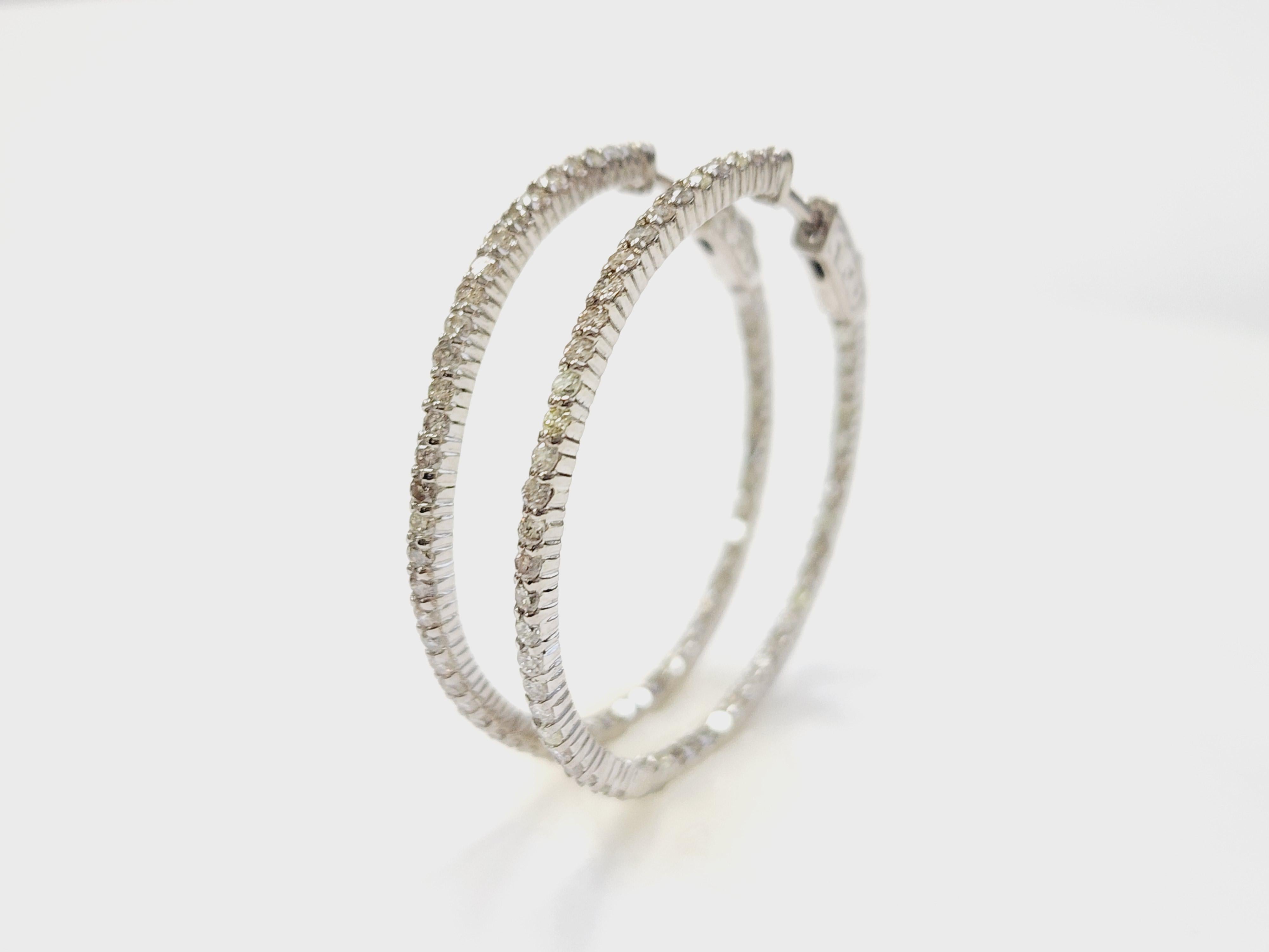 Beautiful pair of natural diamond inside out hoop earrings in 14k white gold. 
Secures with snap closure for wear. Average Color J, Clarity SI-I, Measures 1.25 inch in diameter.
*Free shipping within the U.S*