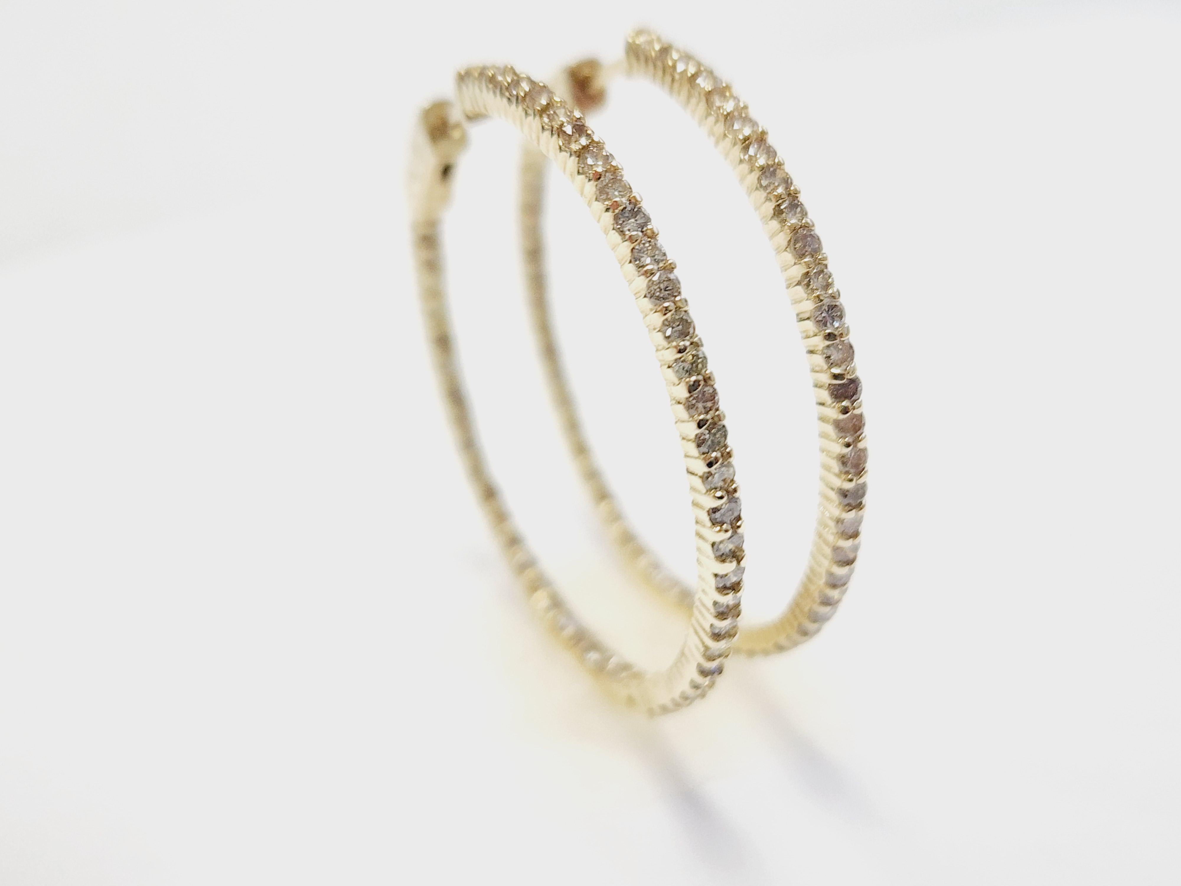 Beautiful Inside-Out Diamond Hoop Earrings in 14K Yellow Gold

Elevate your jewelry collection with these stunning inside-out hoop earrings, crafted in luminous 14K yellow gold. Each hoop showcases a dazzling array of natural diamonds set both