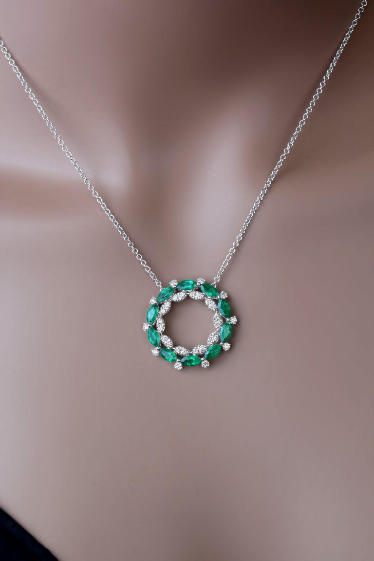 This beautiful circle pendant set in 18k White gold features a series of marquise cut emeralds alternating with round diamonds. Additional round diamonds form a circle of marquise forms, bringing the total diamond weight to 0.68 carats.
Suggested