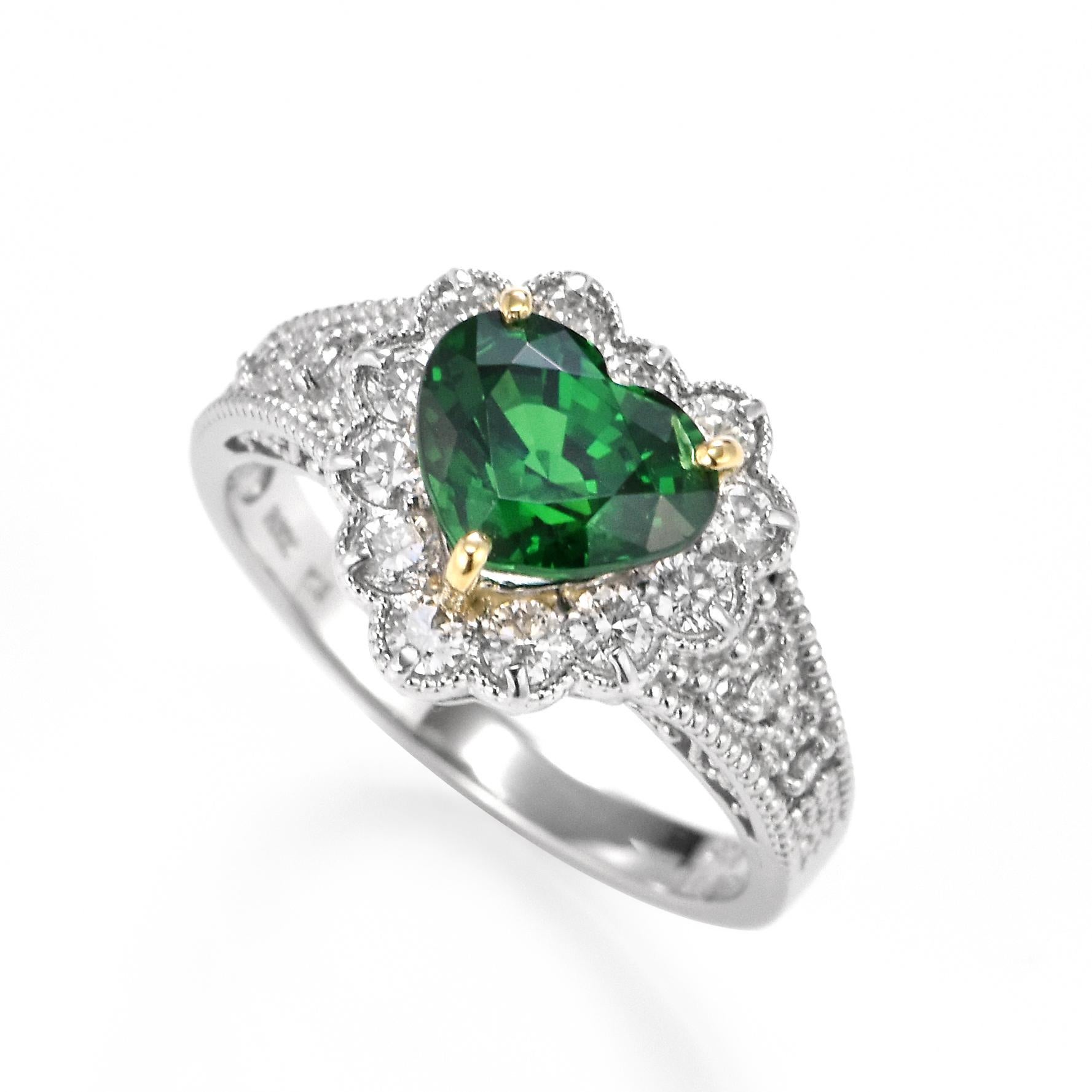 An absolutely gorgeous ring featuring a 1.97 Carat, Natural Tsavorite Garnet and 0.50 Carats of Diamond Accents set in Platinum. Garnets have been adorned by humans throughout history from Ancient Egypt, Rome and Greece. They come in a wide variety