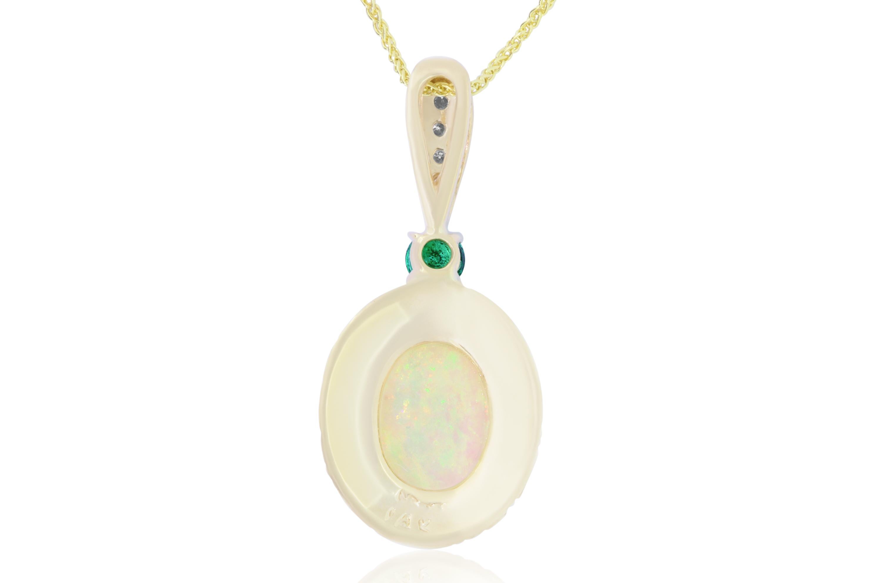 Material: 14k Yellow Gold 
Center Stone Detail:  1 Oval Opal at 1.97 Carats
Mounting Stone Details:  1 Round Emerald at 0.17 carat
Mounting Stone Details: 4 Brilliant Round White Diamonds at 0.10 Carats - Clarity: SI / Color
Chain Length:  18