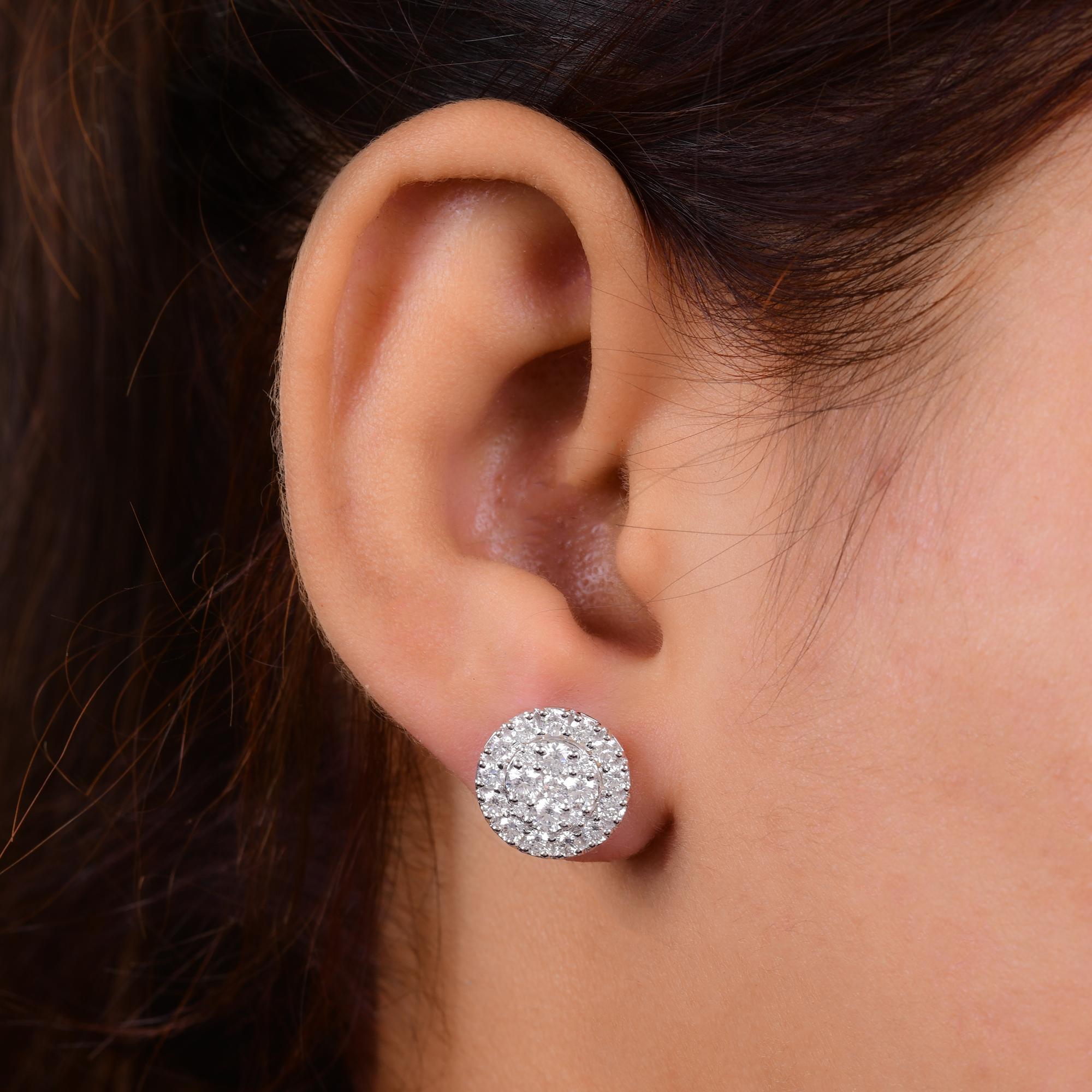 Indulge in timeless elegance with these exquisite diamond stud earrings, featuring a stunning pair of round-cut diamonds totaling 1.97 carats. Each diamond boasts a sparkling brilliance that captivates the eye and radiates luxury. Set in lustrous 18