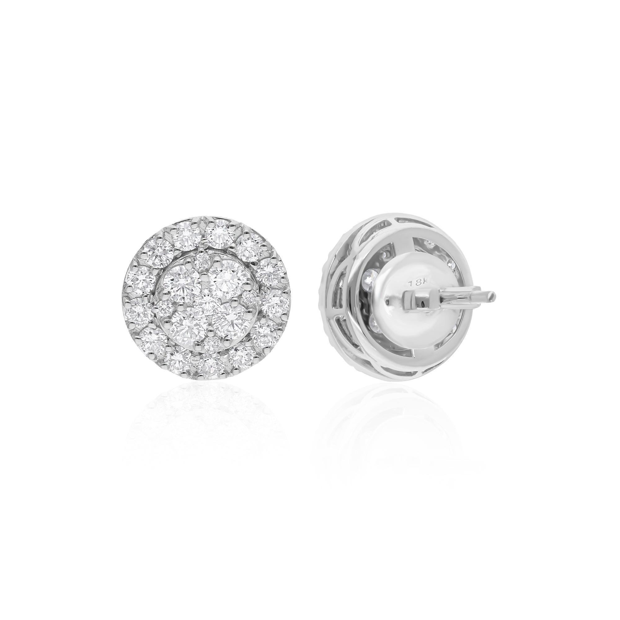 Indulge in timeless elegance with these exquisite diamond stud earrings, featuring a stunning pair of round-cut diamonds totaling 1.97 carats. Each diamond boasts a sparkling brilliance that captivates the eye and radiates luxury. Set in lustrous 18