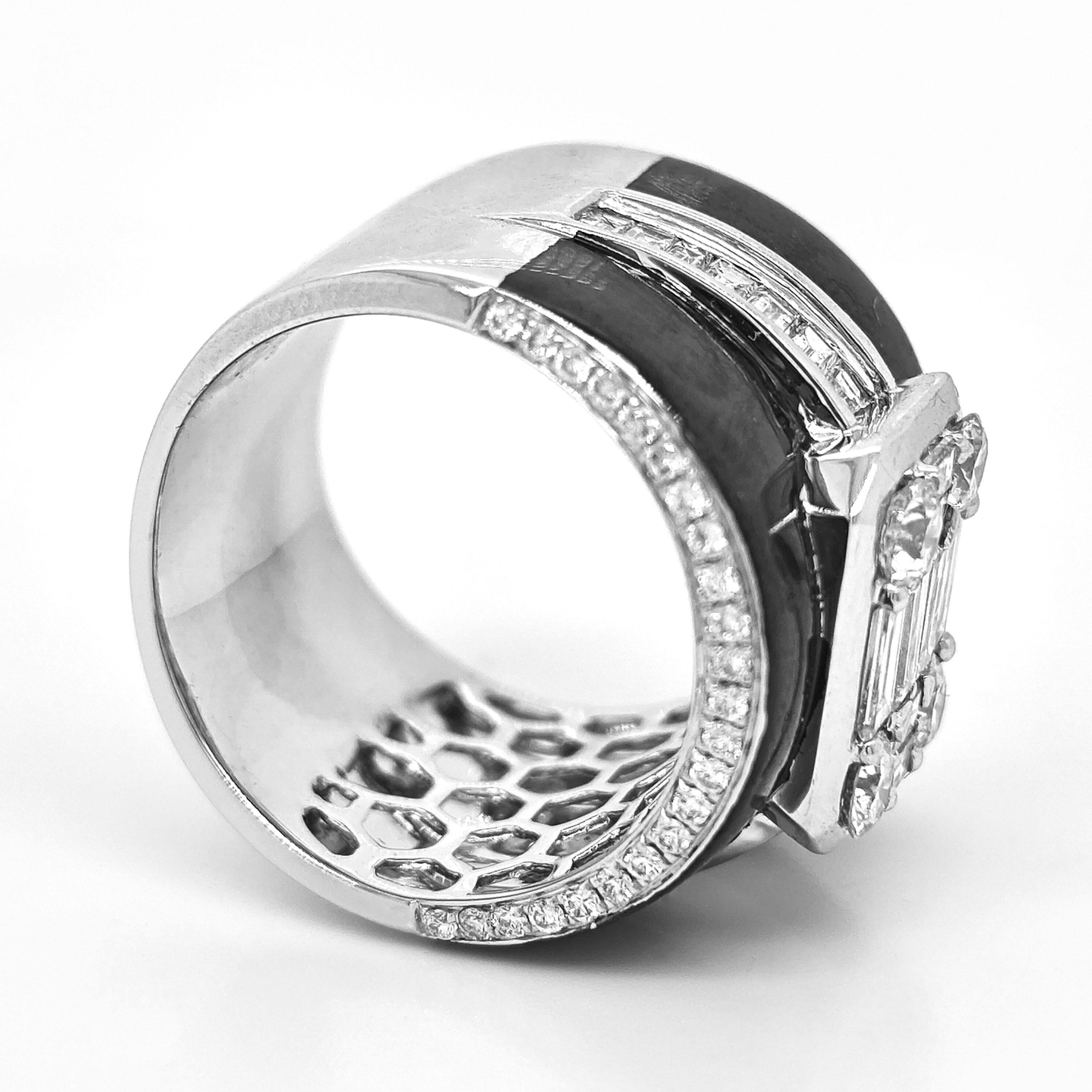 50 White Round Diamonds: 0.89 Carats
22 Baguette Diamonds: 1.41 Carats
Metal: 18K White Gold, 16.47 Grams

