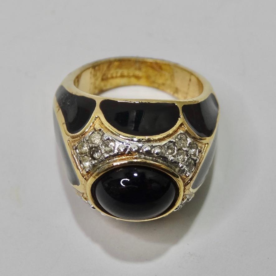 Do not miss out on this simply stunning 18K gold plated ring circa 1990s! This ring is so versatile and special with the shiny black enamel as the focal point and is gorgeously contrasted by the yellow gold. Dome style cocktail ring features a black