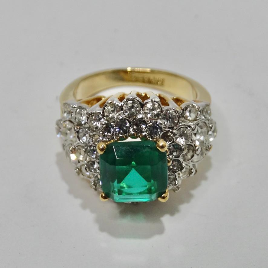 Wow! This timeless 18K HGE princess cocktail ring is going to become your new favorite going out ring! 18K HGE is offset by a stunning arrangement of circle cut silver rhinestones surrounding a beautiful center blue/green stone as the focal point.