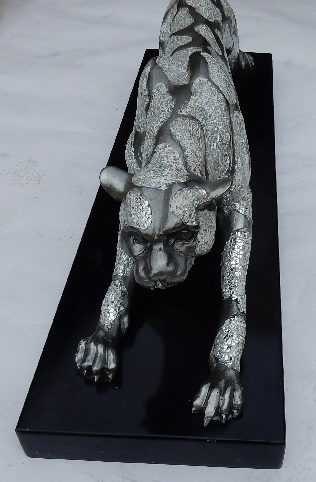 mirrored panther statue