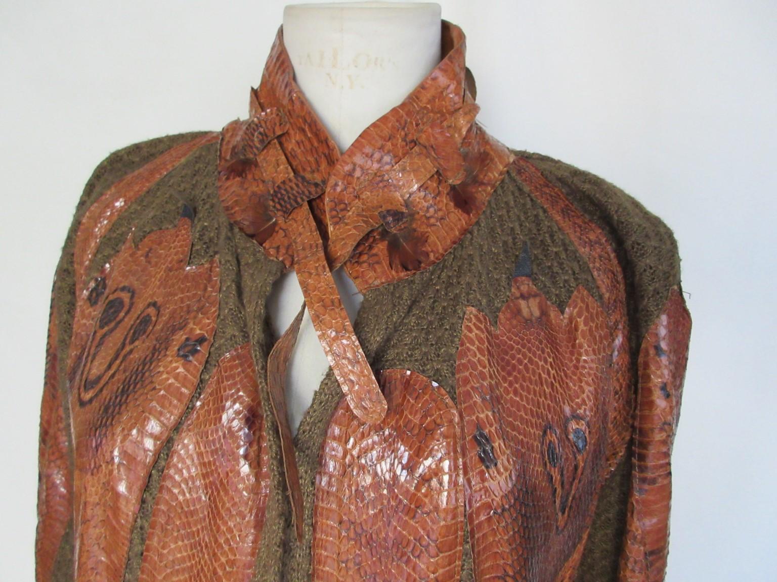 Fabulous original 70s/80s knit coat with  cognac color snakeskin appliqués made in Ibiza, designer Ginger.

We offer more exclusive vintage items, view our frontstore

Details:
Knitted (wool blend) with supple snakeskin appliqués throughout.
No