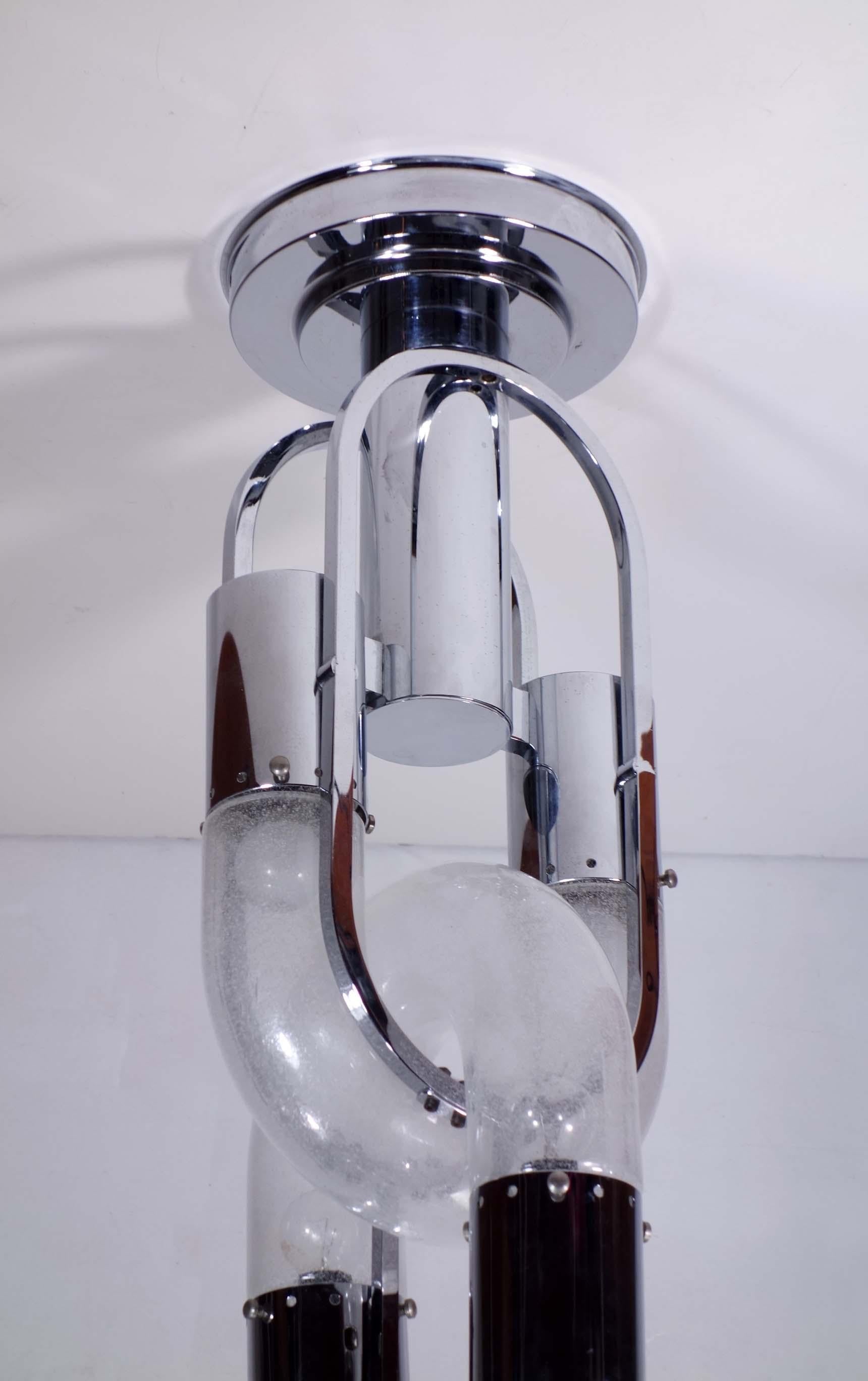 Lampada da soffitto
Aldo Nason
Mazzega
Italia, 1960

Lampada con 10 luci
Vetro soffiato di Murano
Telaio in metallo cromato
Condizioni eccellenti
Occhiali perfetti.

Perfettamente funzionante

