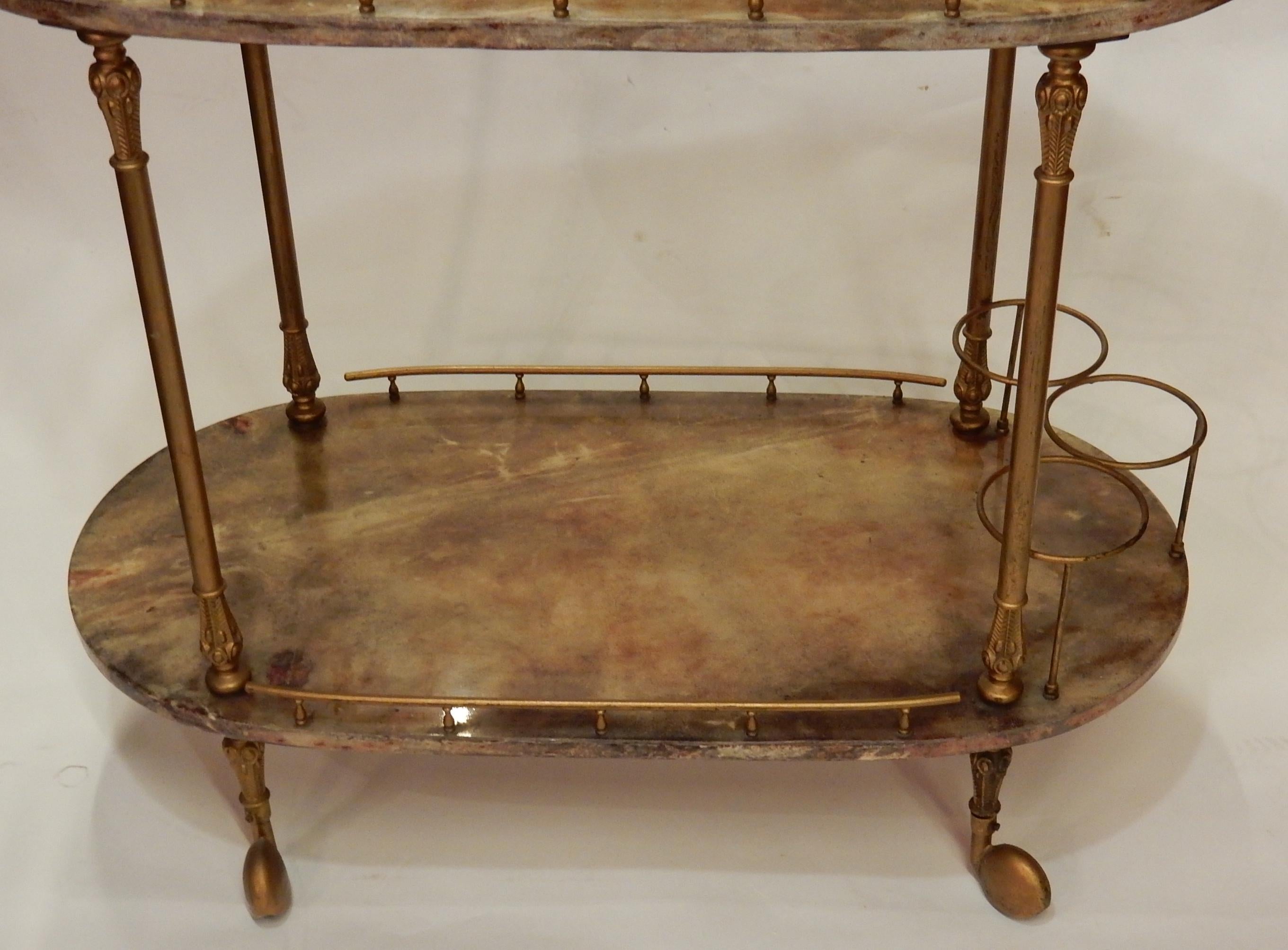 Rolling bar with upright and handle in Louis XV style, trays sheathed in tinted and varnished goat skin, condition of use, circa 1970
Bottle holder, openwork gallery
Everything is screwed, dismountable, easy to send worldwide.

 