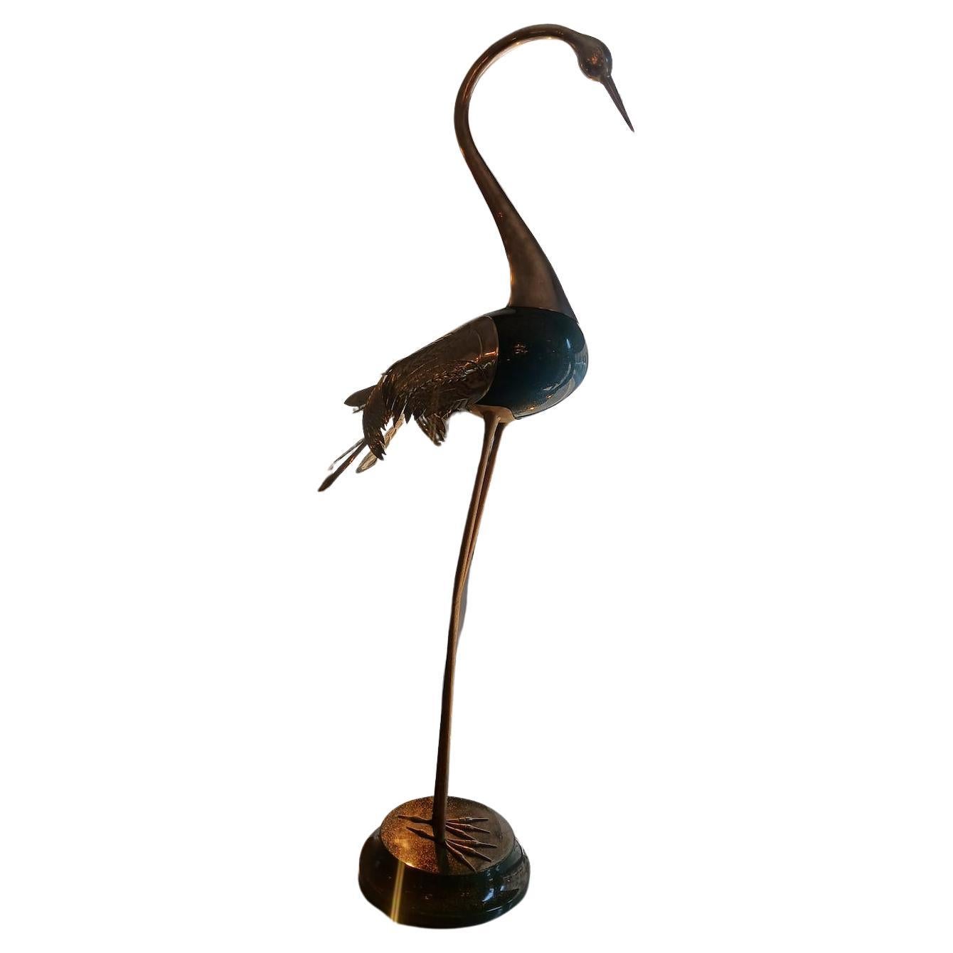 A very tall and slender heron made of brass and painted and lit resin. 
This finish gives a great lustre thanks to the presence of golden straws. 
Height of the heron 175 cm.

Price INCLUDES the costs for any packaging and crates needed to protect