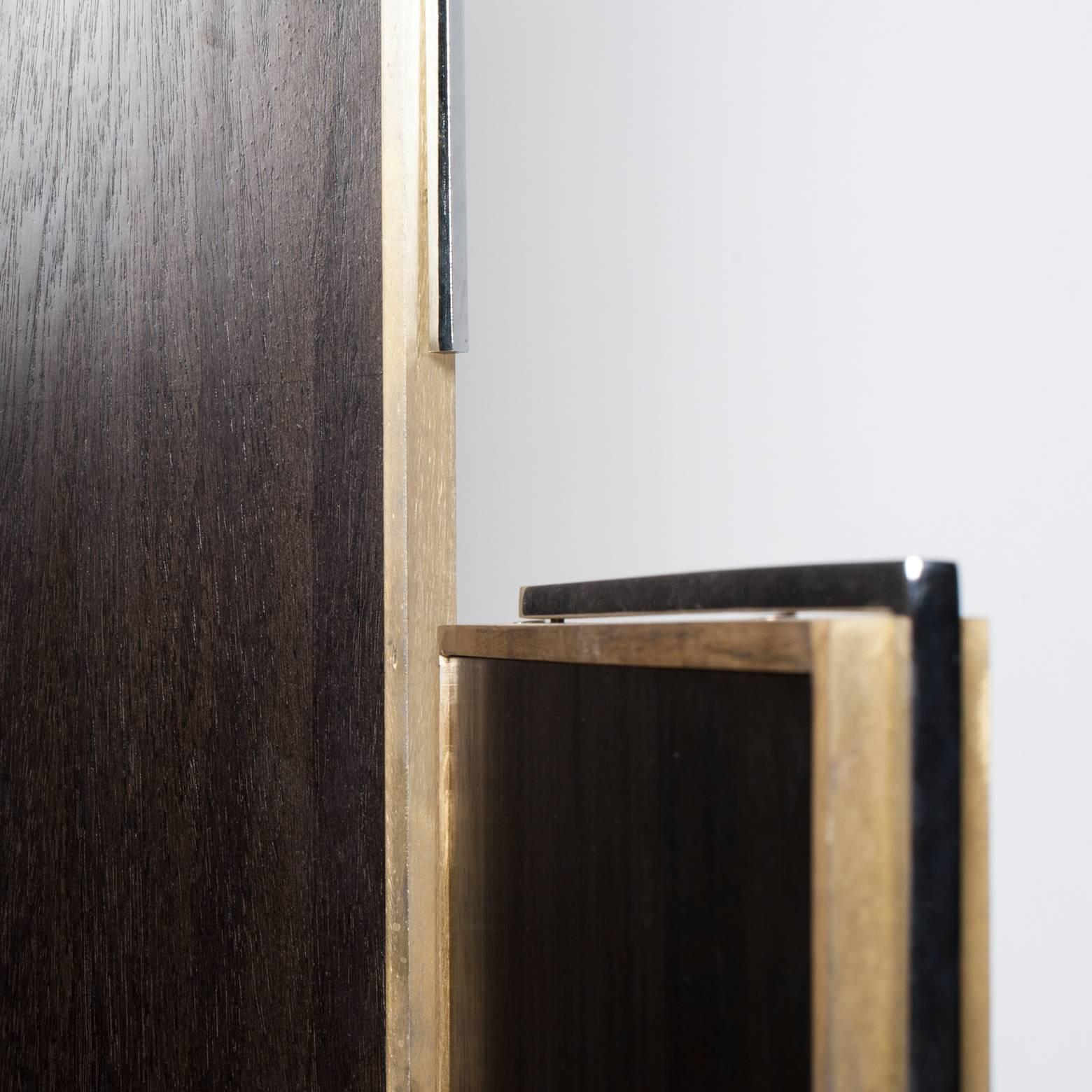1970 screen, asymmetrically with three different heights, ebony wood framed in bronze and chrome metal.