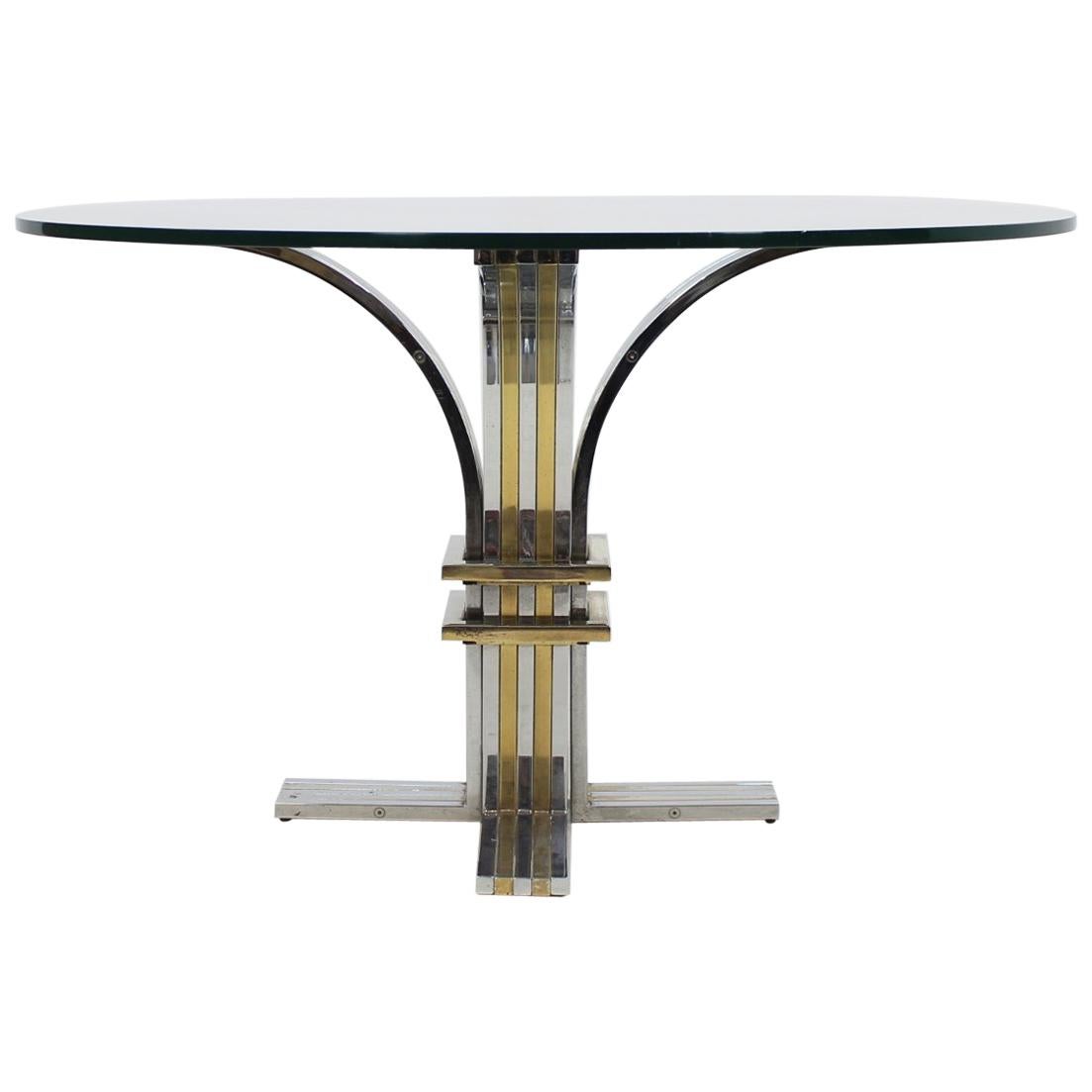 Très belle table à manger sculpturale fabriquée par Banci et Firenze, Italie, 1970.
Cette base de table était constituée de tubes carrés cintrés en chrome et en laiton, sur lesquels était fixé un grand plateau en verre.
Table de grande qualité et