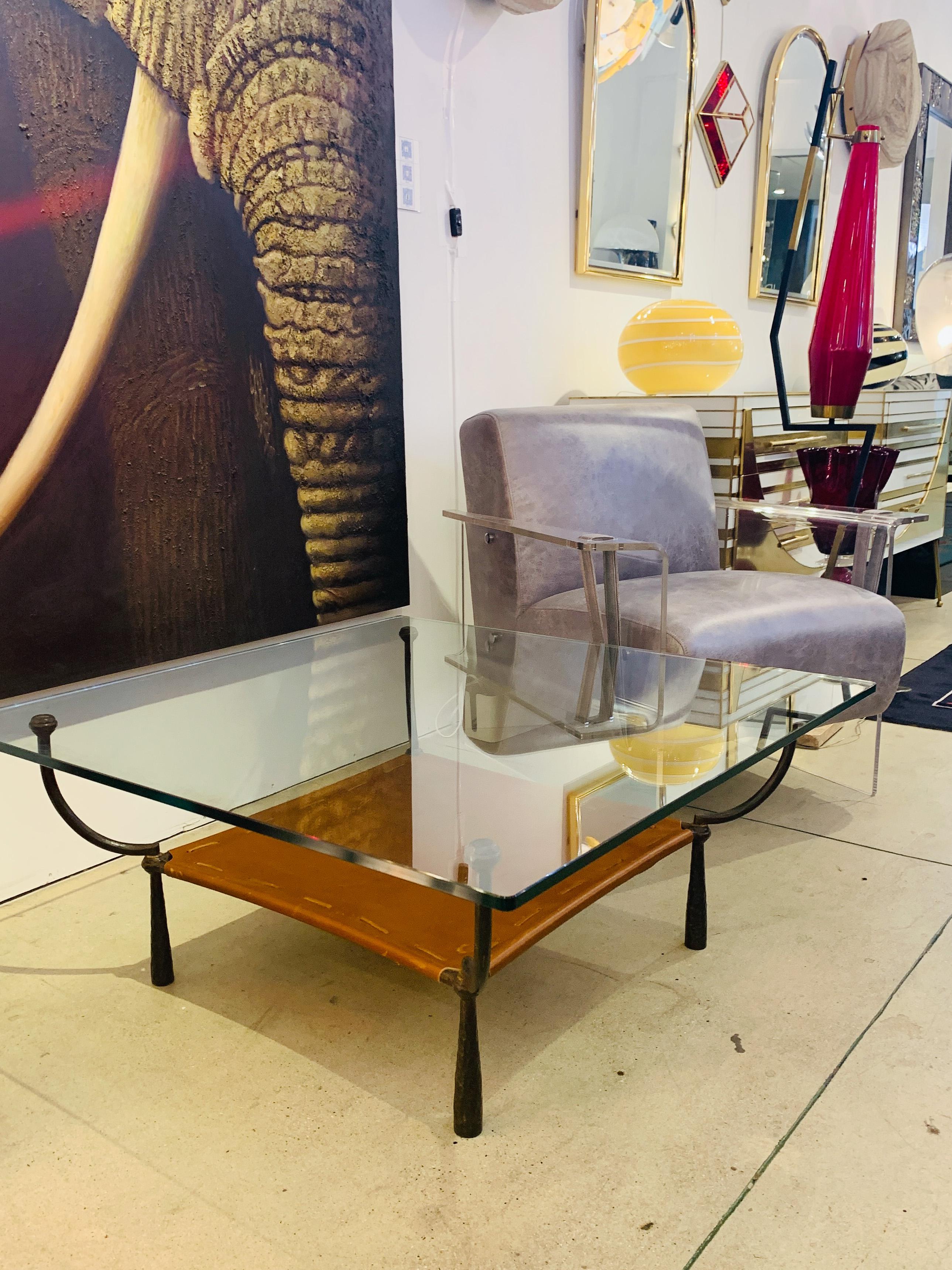 Mid-Century Modern, very rare end table by Banci - Firenze, entirely hand made, the organic frame in a magnificent organic wrought and hammered iron, with a sophisticated medieval flair, supports an under shelf in brown Italian leather, stitched and
