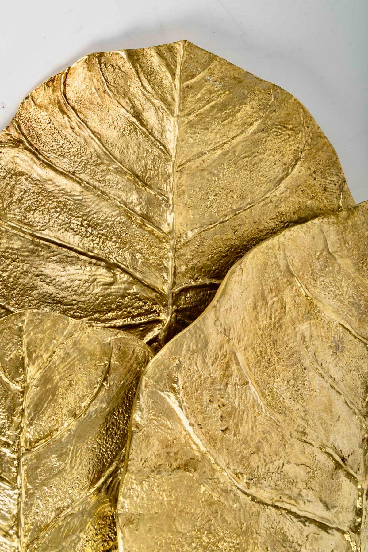 Maison Charles, plant wall light in gilded bronze. Guadeloupe model designed by Chrystiane Charles in the 1970s.

The wall light is composed of three gilded bronze leaves in three different sizes, signed and numbered.

2 bulbs

 