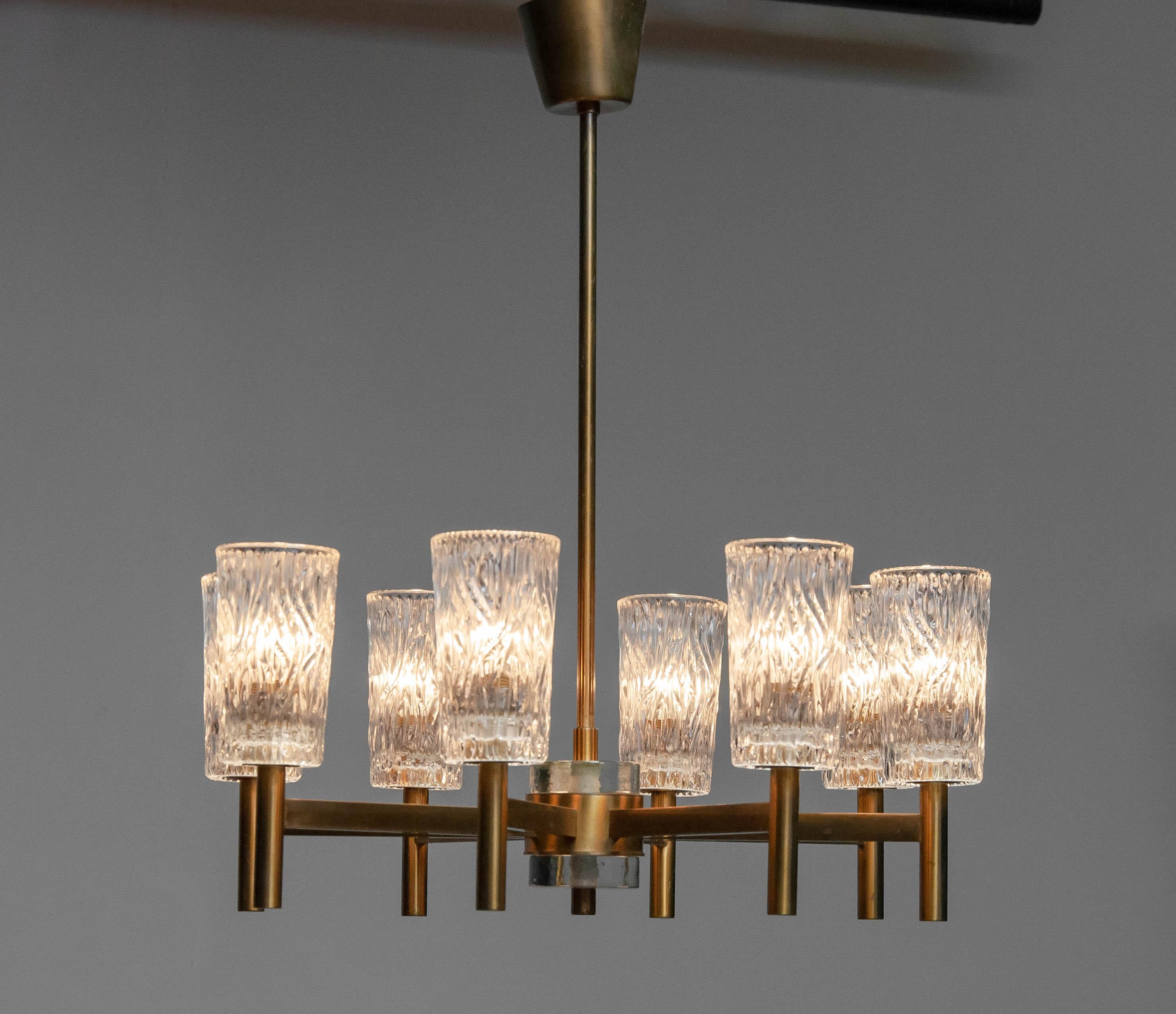 Scandinavian Modern Eight Arms Brass Chandelier With Clear Art Glass Vases By Markaryd Sweden 1970s For Sale