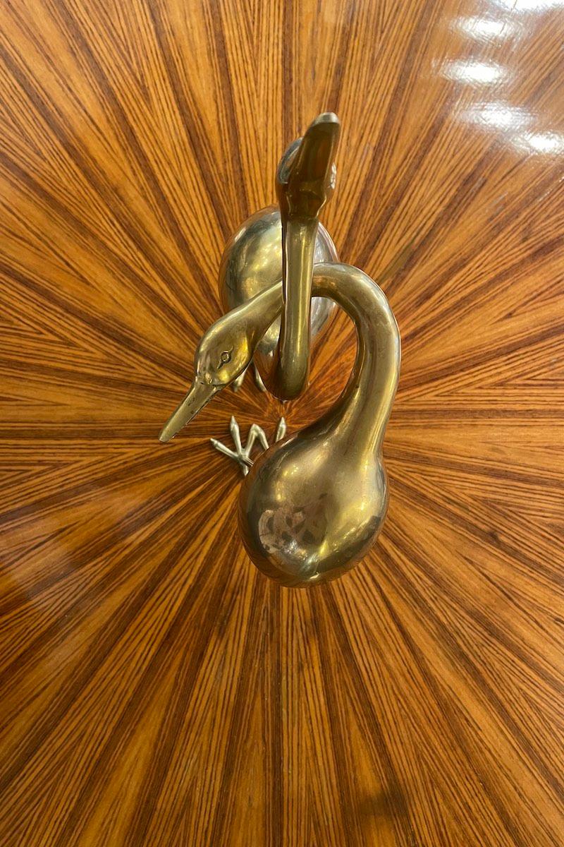 Pair of gilded brass herons from the 1970s.
This pair of sinuously shaped herons can be displayed entwined as presented in the gallery, or separate as in the photograph. 
The herons are in excellent condition and are a very fine