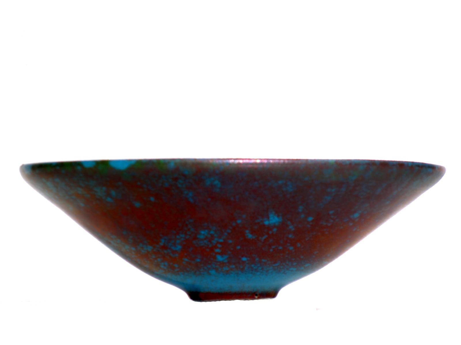 Carlo Zauli
Faenza, 1970

Ceramic Dish
Metallic enamels and in shades of blue

Artist's signature at the base
Perfette condizioni