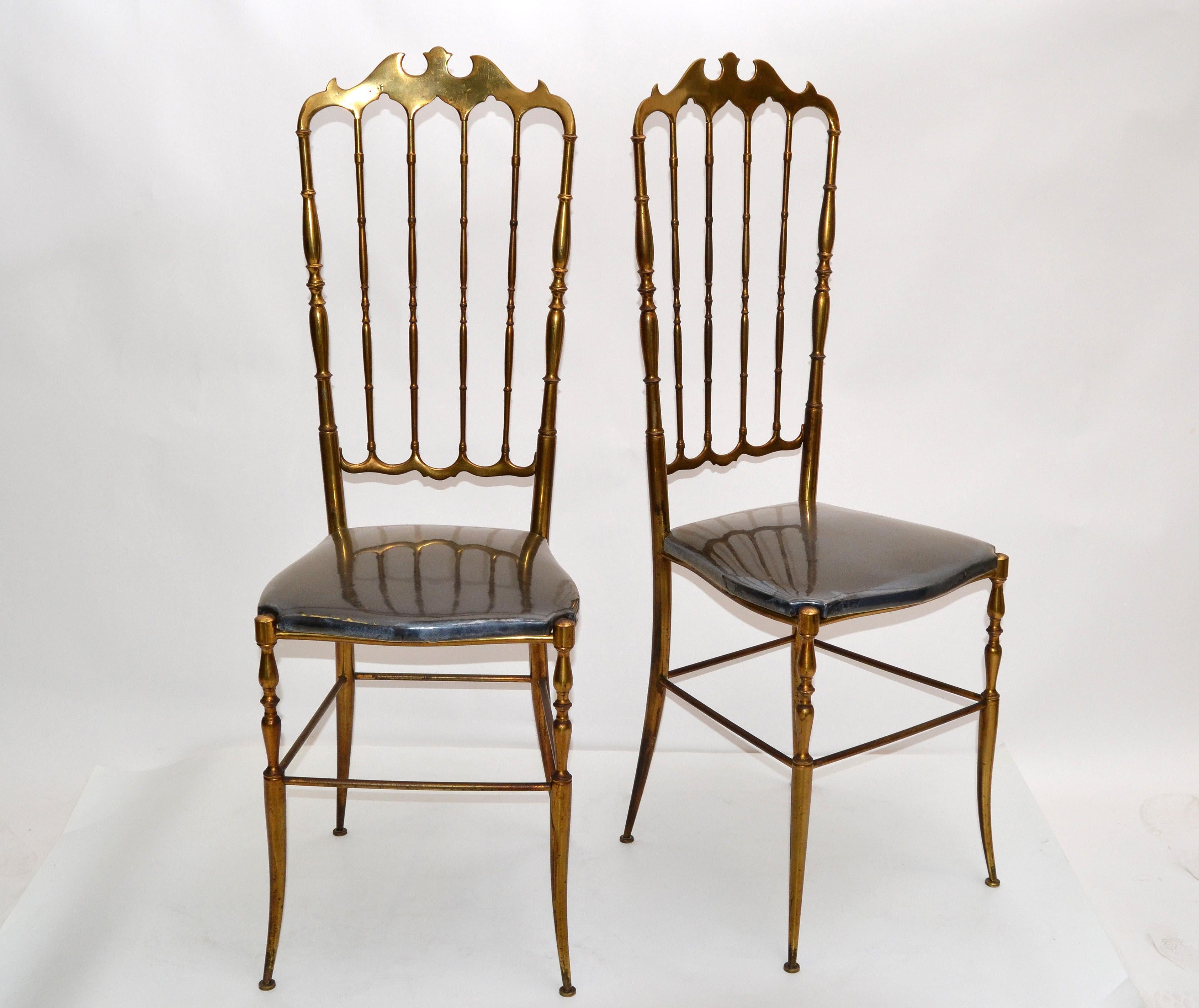 Pair of Mid-Century Modern high back bronze Chiavari chairs made in Italy, circa 1970. 
The pair retains the original dark grey-charcoal Velvet seat under the foil and have a gothic looking back rest. 
Similar chairs are at the Le Crystal Room