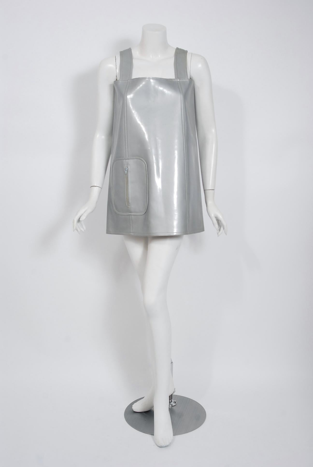 A rare Christian Dior documented silver vinyl mini dress dating back to their 1970 spring/summer collection.  The Colifichets boutique was found on the ground floor of the Dior Haute Couture atelier at 30 Avenue Montaigne in Paris. It allowed Dior