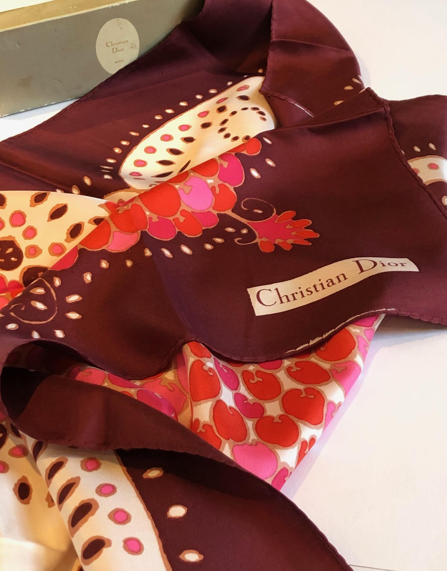1970 CHRISTIAN DIOR Flower Multi Silk Printed Scarf 
Christian Dior beautiful silk scarf in very warm stunning colour tone, Bordeaux, red, pink, brown with off-white background and flower motifs print, 100% silk.  The CD Box in the photos is not for