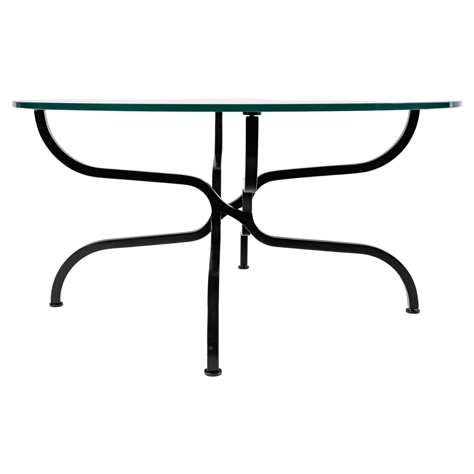Coffee table 1960 by Georges Geffroy

Composed of a satin black lacquered metal base with a square section formed by four flared legs resting on the floor and then forming very ingenious and beautiful volutes intertwining on the first third under