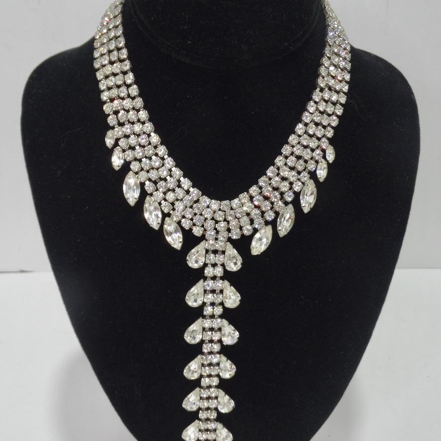 This vintage rhinestone drop necklace is begging to be added to your jewel collection! The most spectacular 1970s rhinestone chocker necklace with an extra long and dramatic drop motif that is so beautiful and eye catching. This is the perfect go to