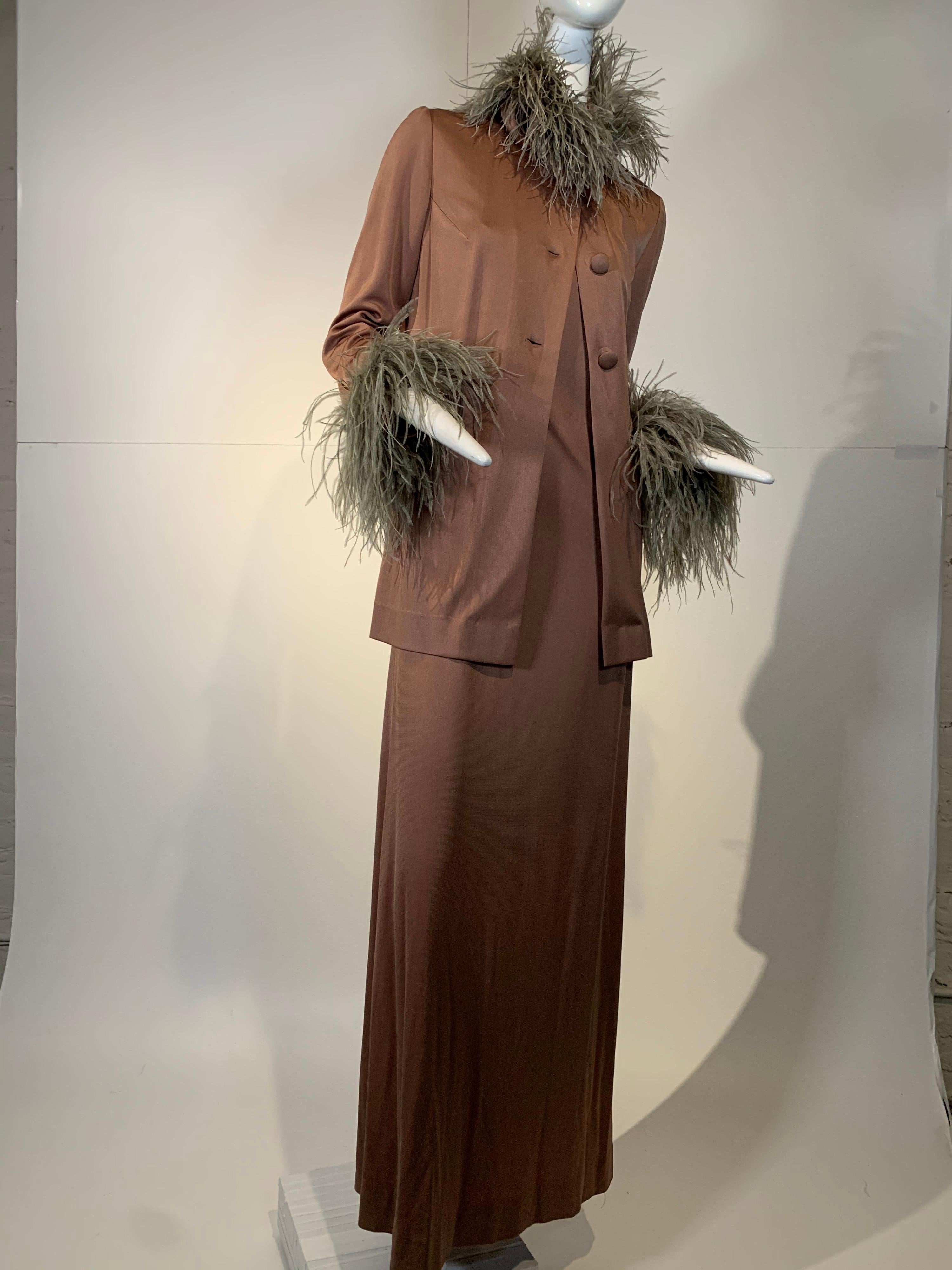 1970s Dior Boutique by Marc Bohan for Christian Dior. Euro-jersey mocha brown disco gown and jacket ensemble with natural ostrich feather trim at neckline and cuffs. A Saks Fifth Avenue exclusive made in France. Jacket buttons down front. Gown is