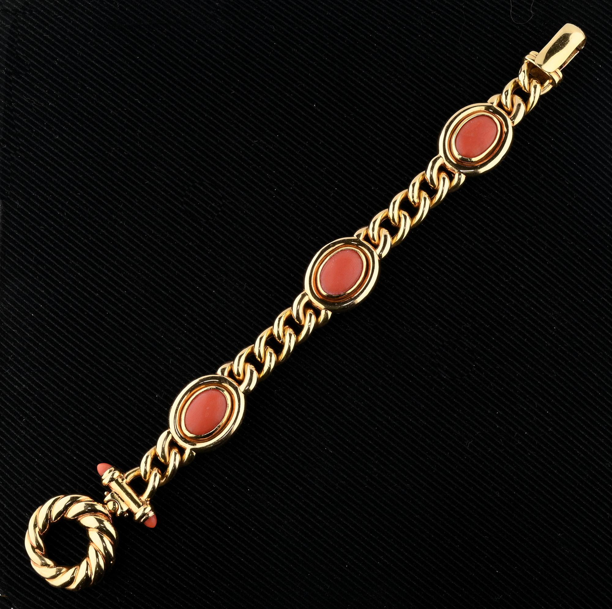 This beautiful fancy link bracelet is 1970, Italian origin, hand made of solid 18 KT gold
Charming combination of classy curb links inter-spaced by three oval sections of gold set with natural Mediterranean Red Coral and fancy closure with Coral