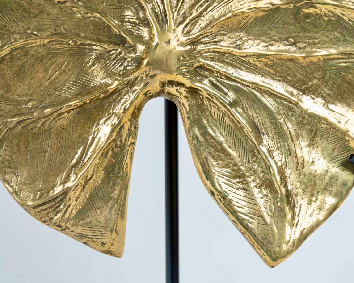 Gilded bronze plant leaf, 
Guadeloupe model designed by Christiane Charles of the iconic Maison Charles in the 1970s, signed on the back of each leaf.

41 X 17 X 10
35 x 17 x 10
