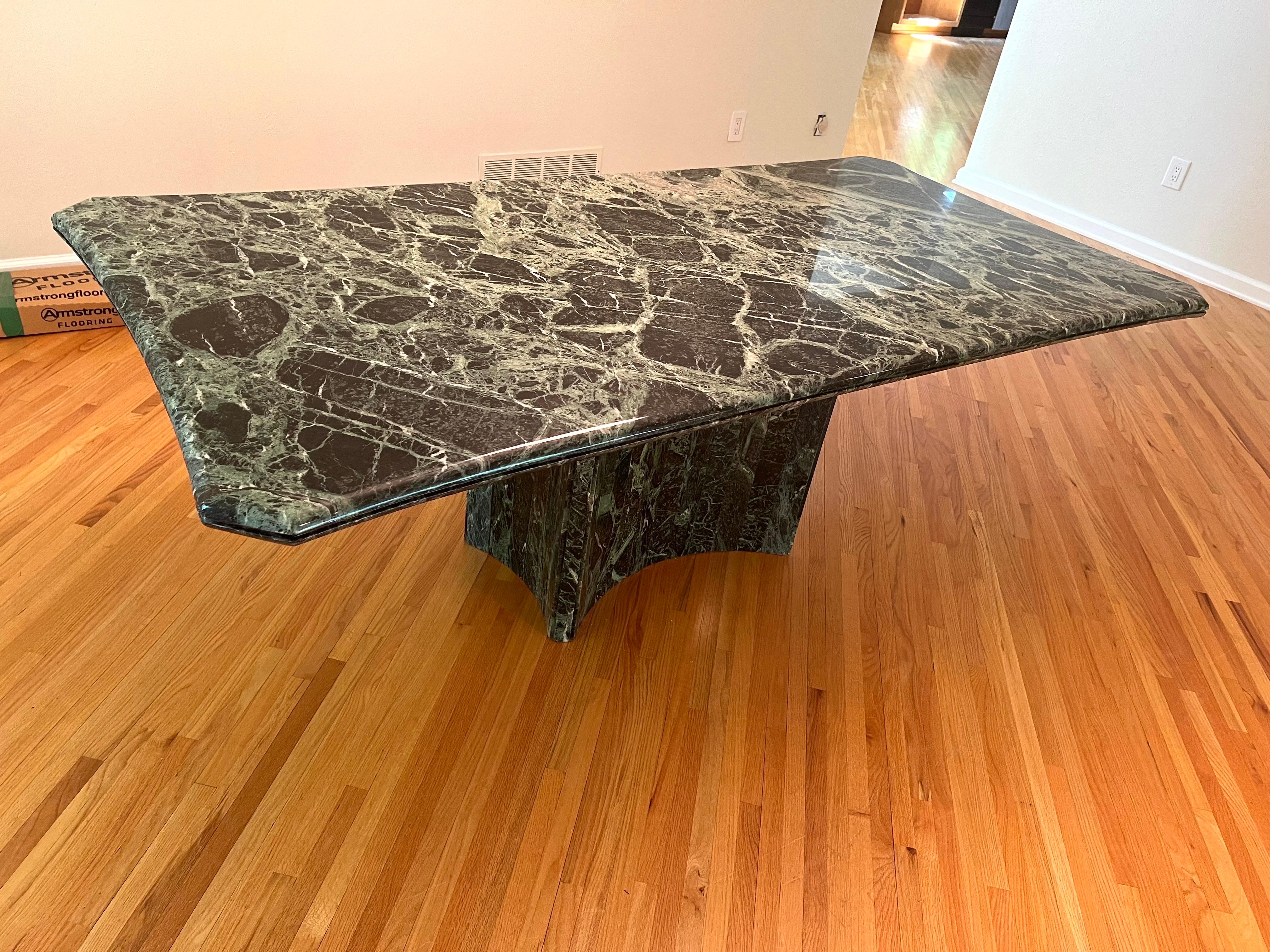 1970 Green Marble Stone Dining Table, Made in Italy

The pedestal base is made of many individual pieces of rectangular green marble that create the cascade effect, unlike other dining table base with just the flat surface pedestal.

The table top