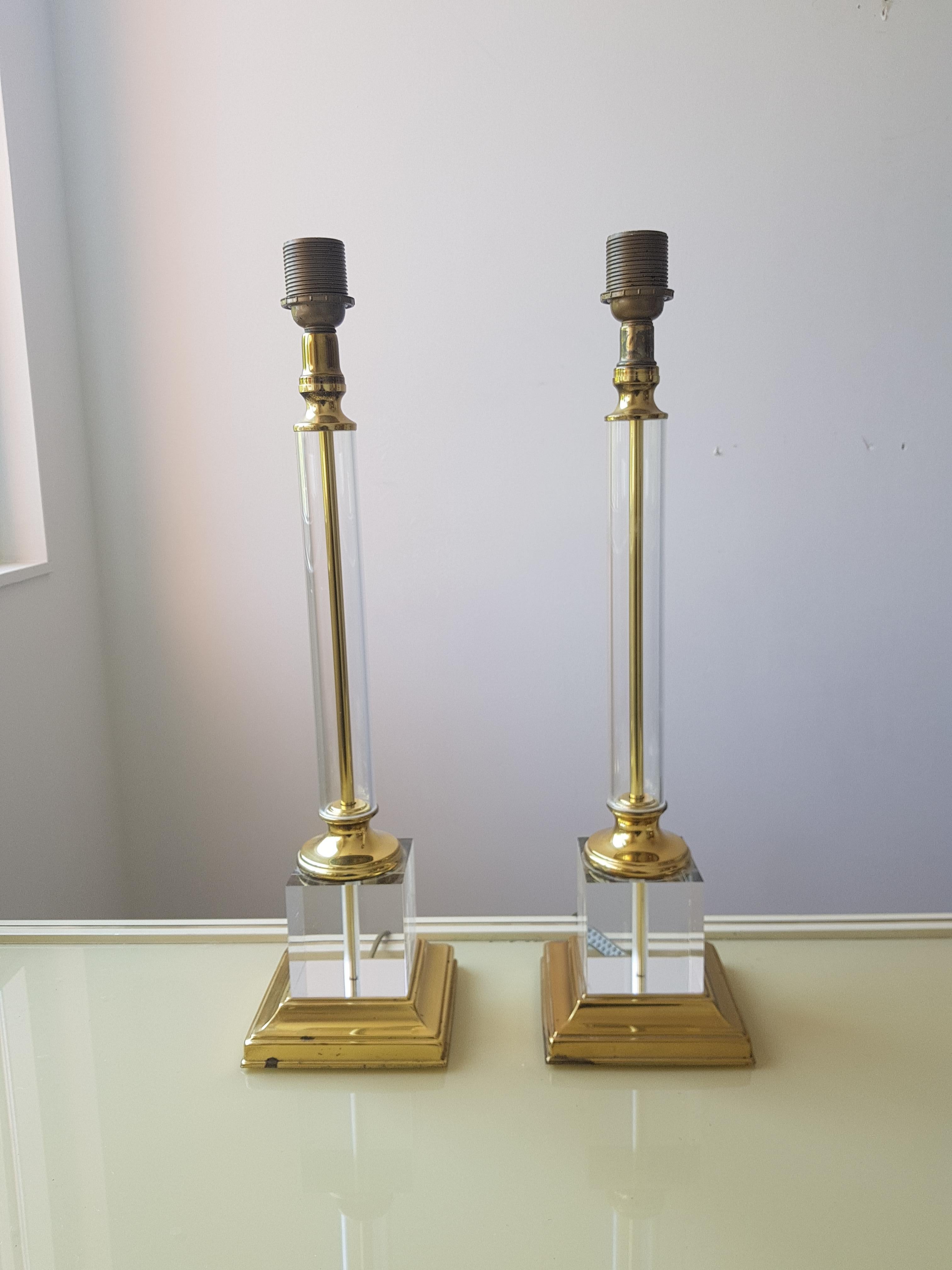A pair of large brass, glass and Lucite lamps, from the 1970s. The lamps have a brass foot and than a Lucite cube on which the glass tube is mounted, this truly the work of an designer but which I am still not sure.
Comes with free bulbs.

Rewired: