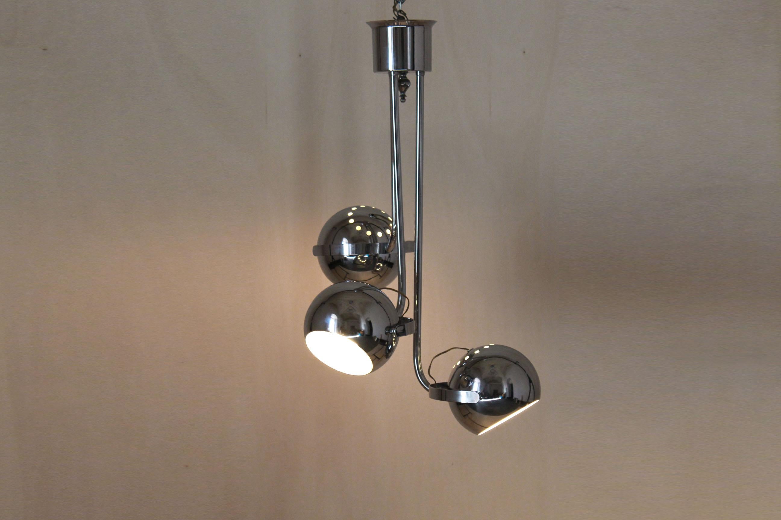 Space Age Chandelier with Three Flexible Light Spots, Reggiani Italy , 1970s.
A Reggiani vintage chromed chandelier composed by three lights spot. The item has been polished and electrical components revised by a professional. In excellent