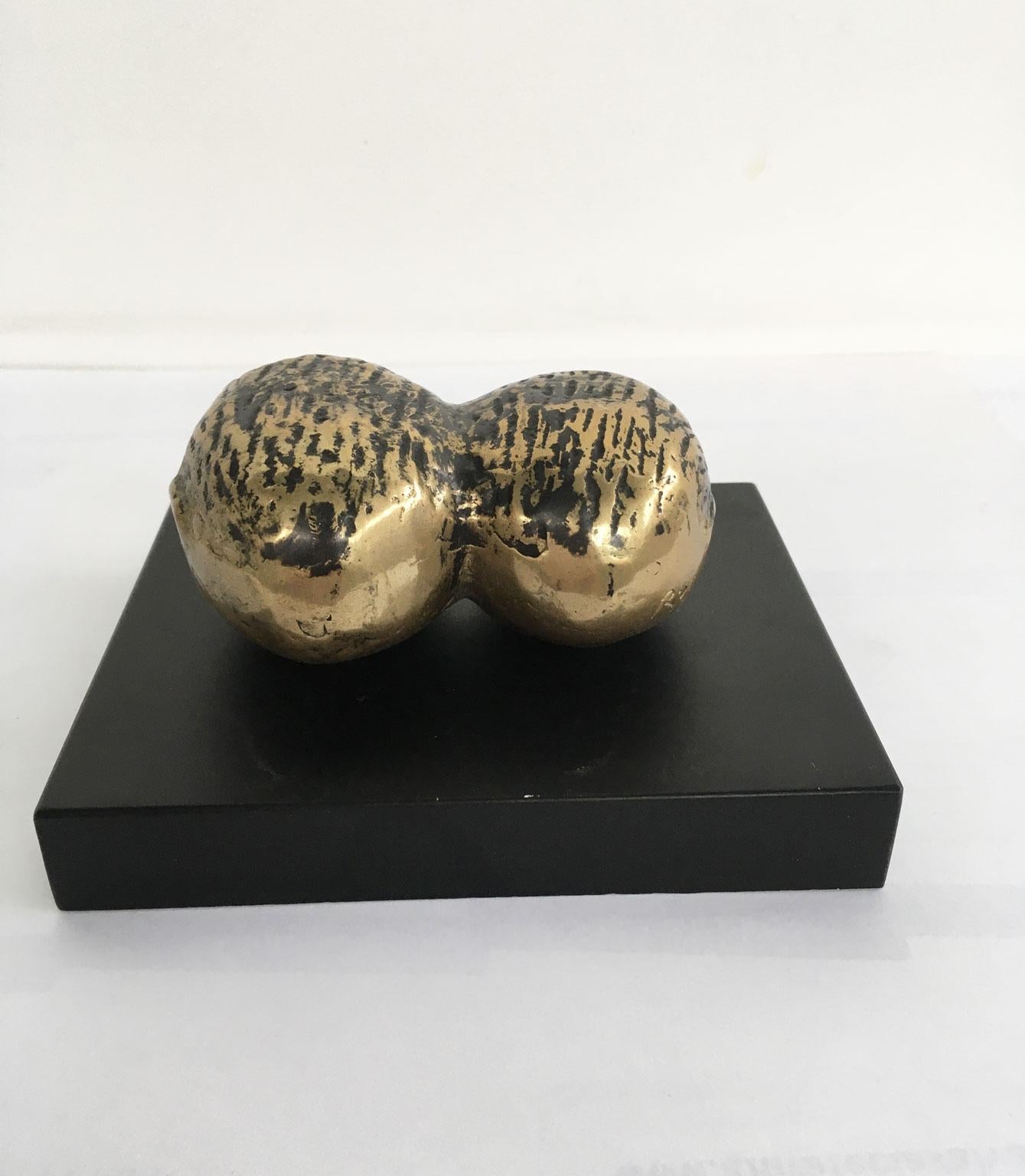 This intense abstract bronze sculpture was created by the Italian artist Eli Riva in the Late 20th Century. The artwork is a multiple numbered and signed of 500 specimens. The title is 