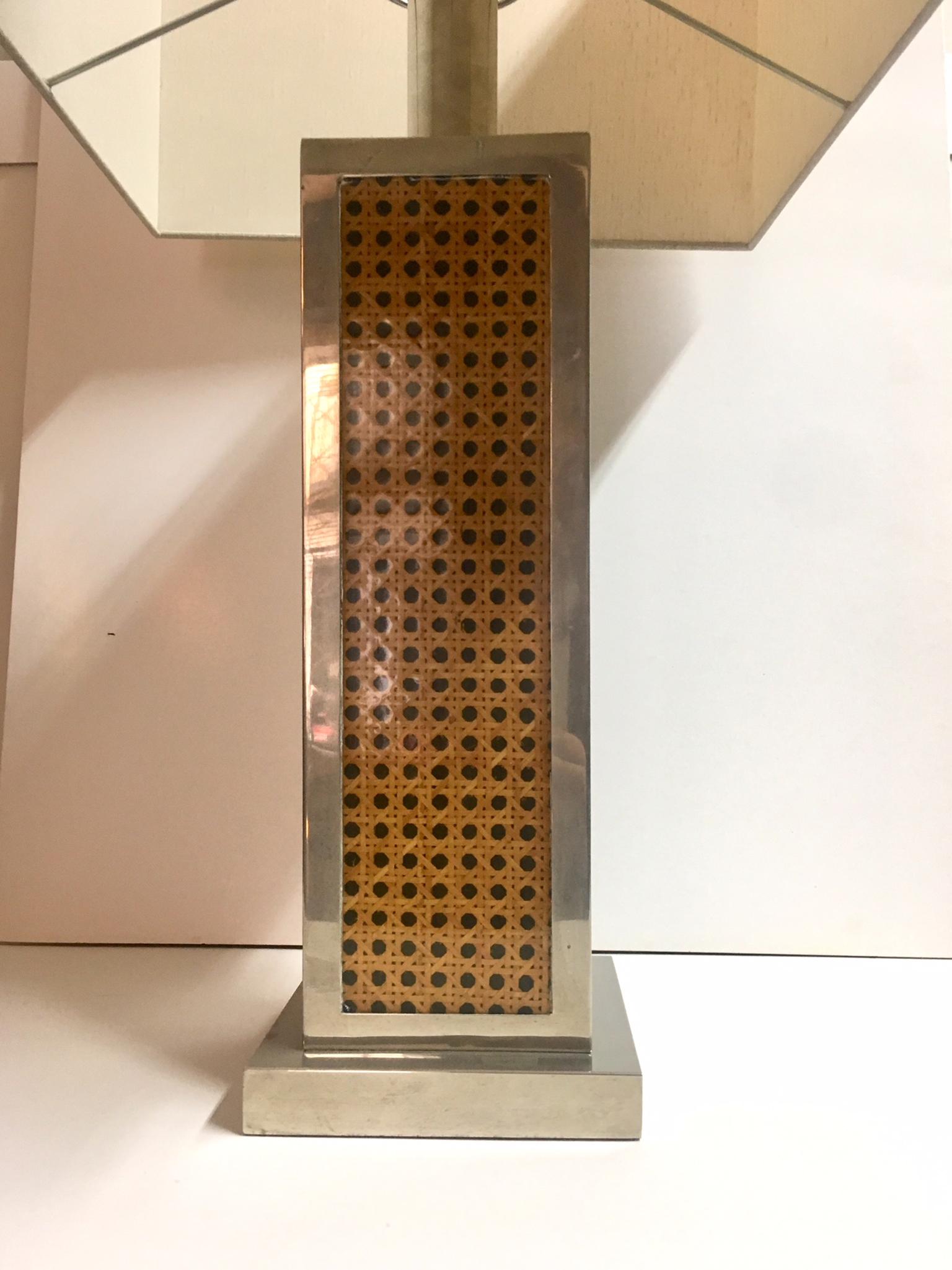 1970 chromed Lucite and caned rattan table lamp with silk shade.