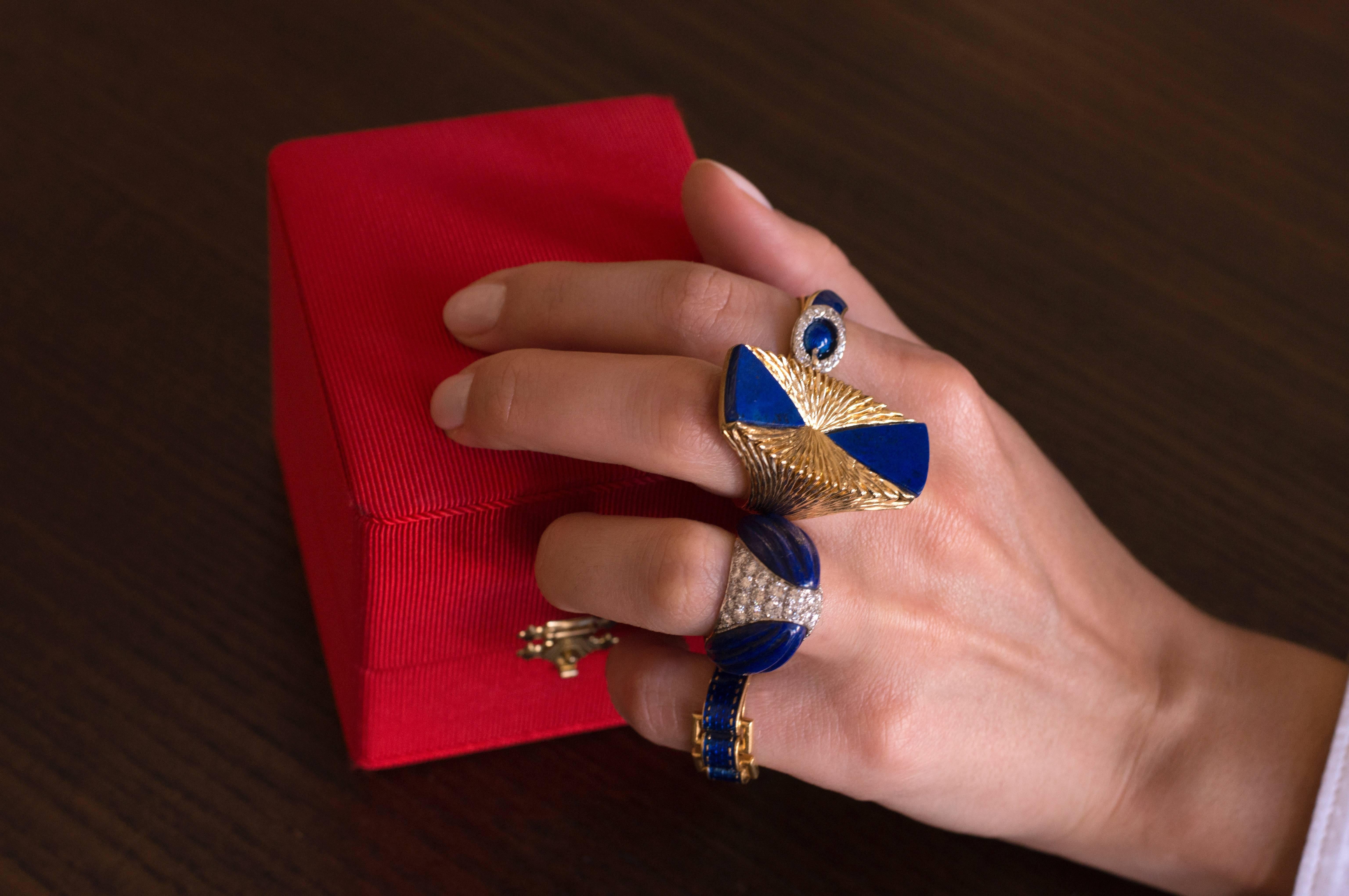 A carved lapis lazuli, pavé-set diamond and 18 karat gold ring, by the London jewelry house of Kutchinsky, 1970. Ring size 6.5 and stamped Kutchinsky, makers mark K LD, London Hallmarks dated with the letter 