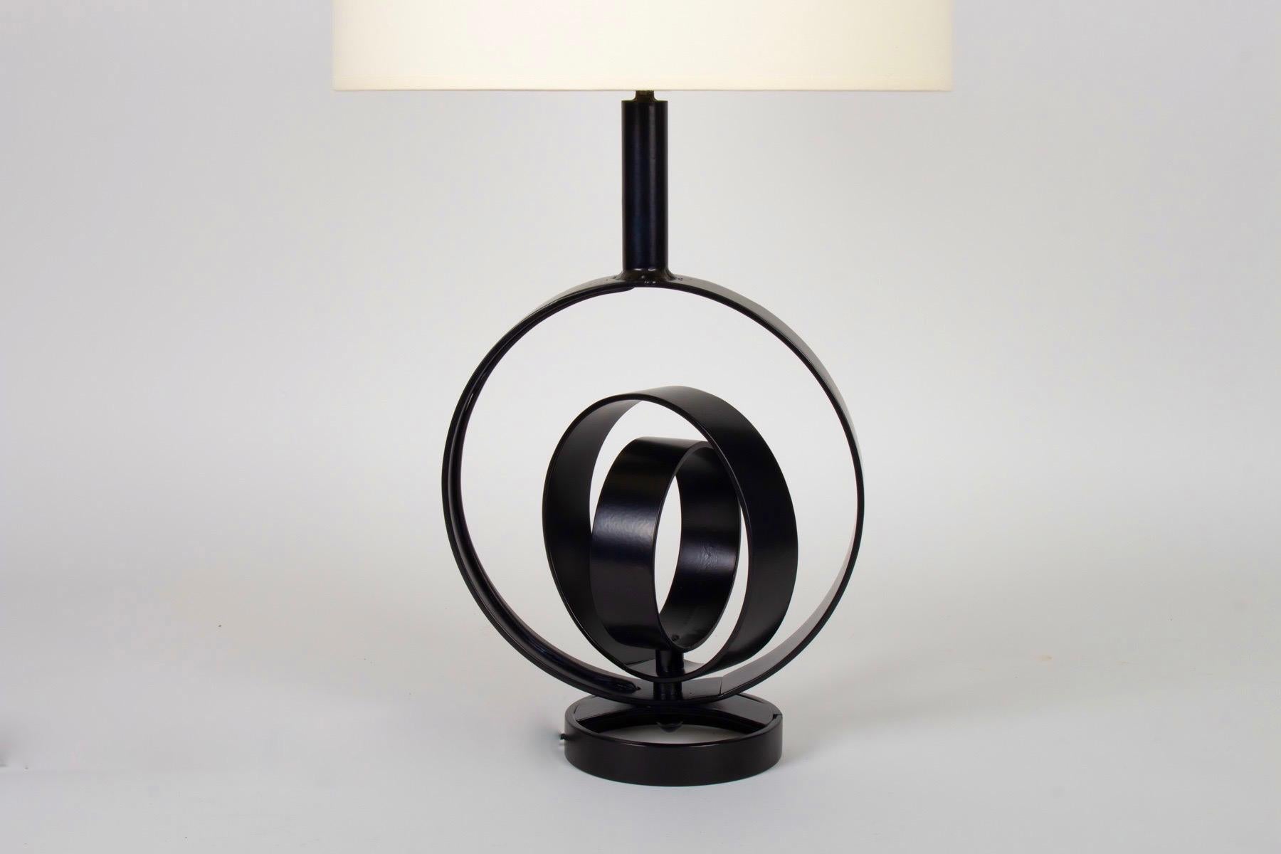 Large black wrought iron lamp inspired by the terrestrial globe from 1970
Beautiful work of ironwork done by hand. Unique piece
Composed of a large circle in black flat wrought iron in which 2 other circles of different sizes and positioned with
