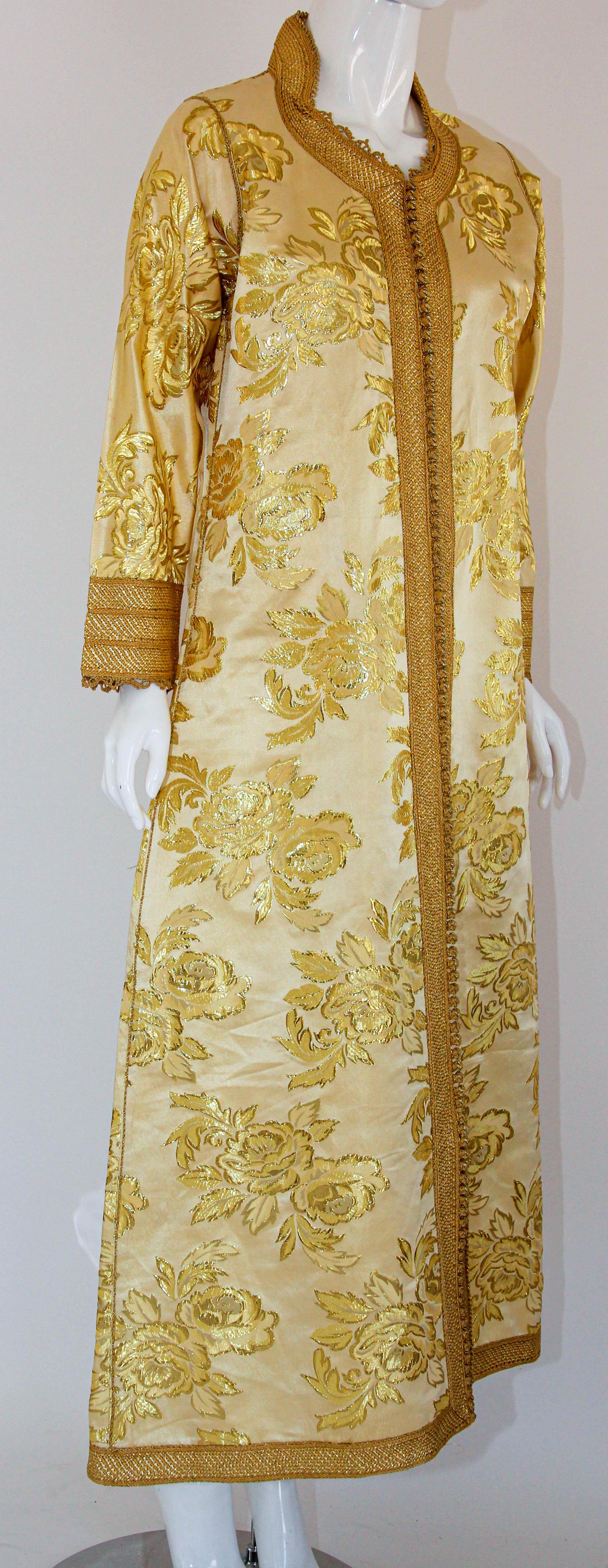 1970s vintage metallic gold brocade dress kaftan with gold trim.
Hand-made ceremonial caftan from North Africa, Morocco.
Vintage exotic 1970s gold damask metallic brocade caftan gown.
The luminous gold metallic caftan maxi dress caftan is made in a