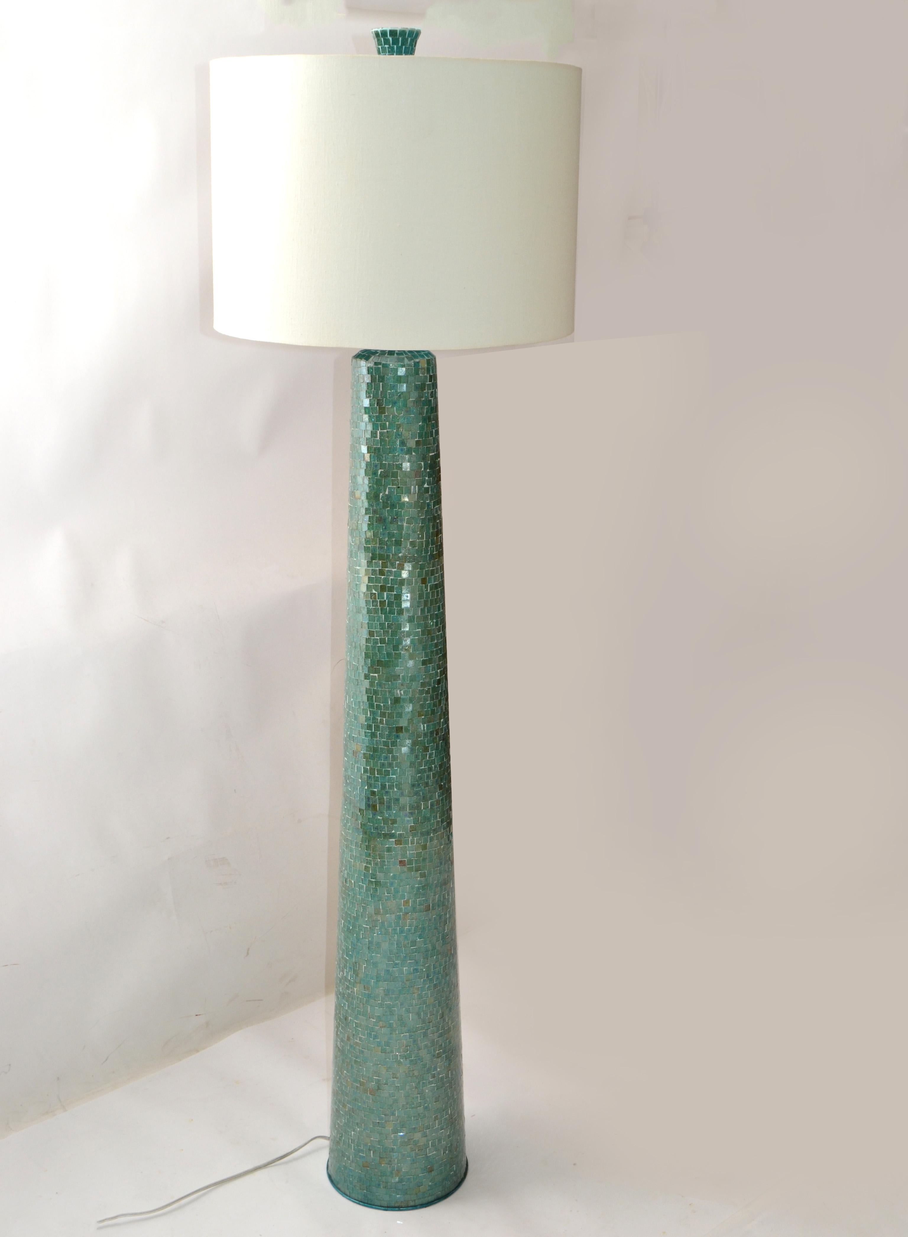 Hollywood Regency 1970s floor lamp in hues of green mosaic glass pieces over a wood Cone Shaped Lamp Body with Chrome hardware.
Every single piece of glass is cut and fixed by hand guaranteeing high quality, each artistic element is unique in its