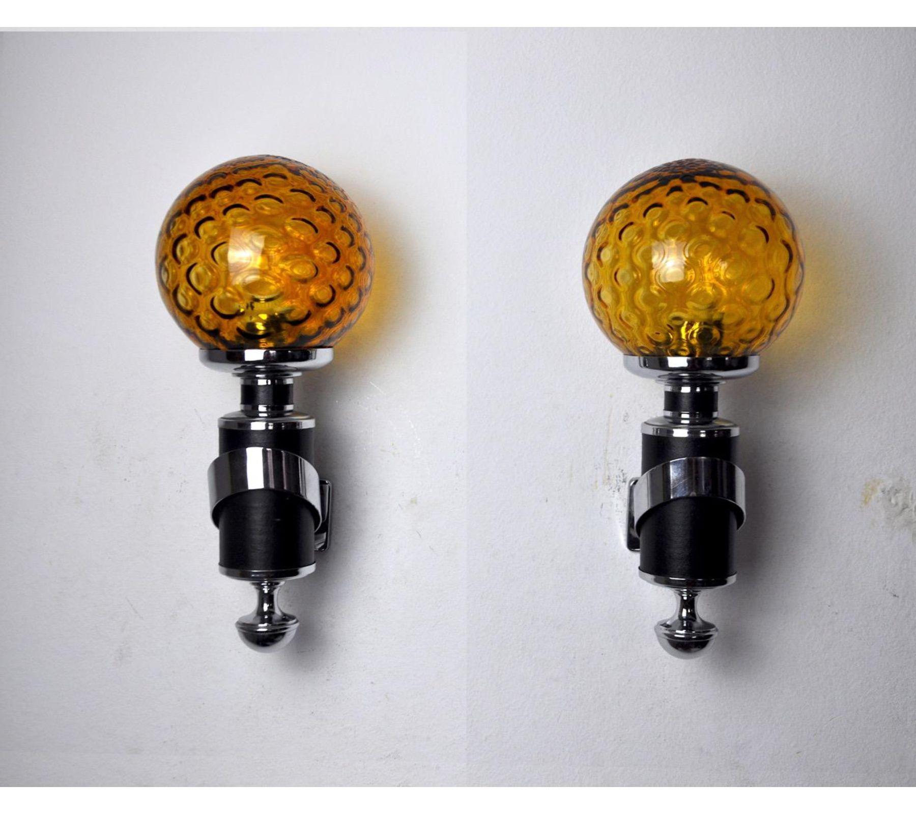 Very nice pair of Murano wall lamps designed and produced in Italy in the 1970s. Orange glass and chrome metal structure. Unique object that will illuminate perfectly and bring a real design touch to your interior. Electricity verified, mark of time