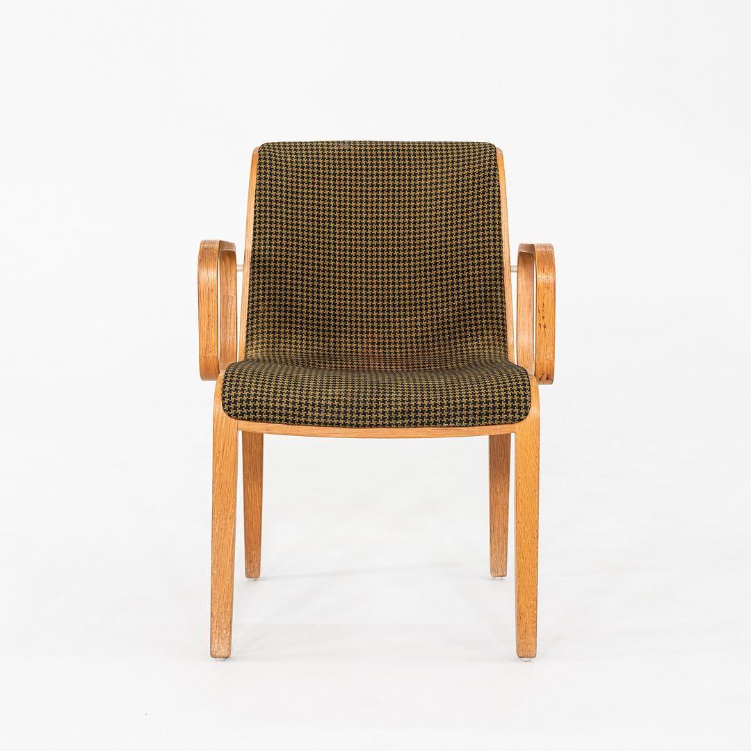 This is a pair of 1300 Series Dining Chairs, originally designed by Bill Stephens for Knoll in the late 1960s. These particular examples date back to the year 1970. Their frame and legs are composed of birch and they feature a seat and back that are
