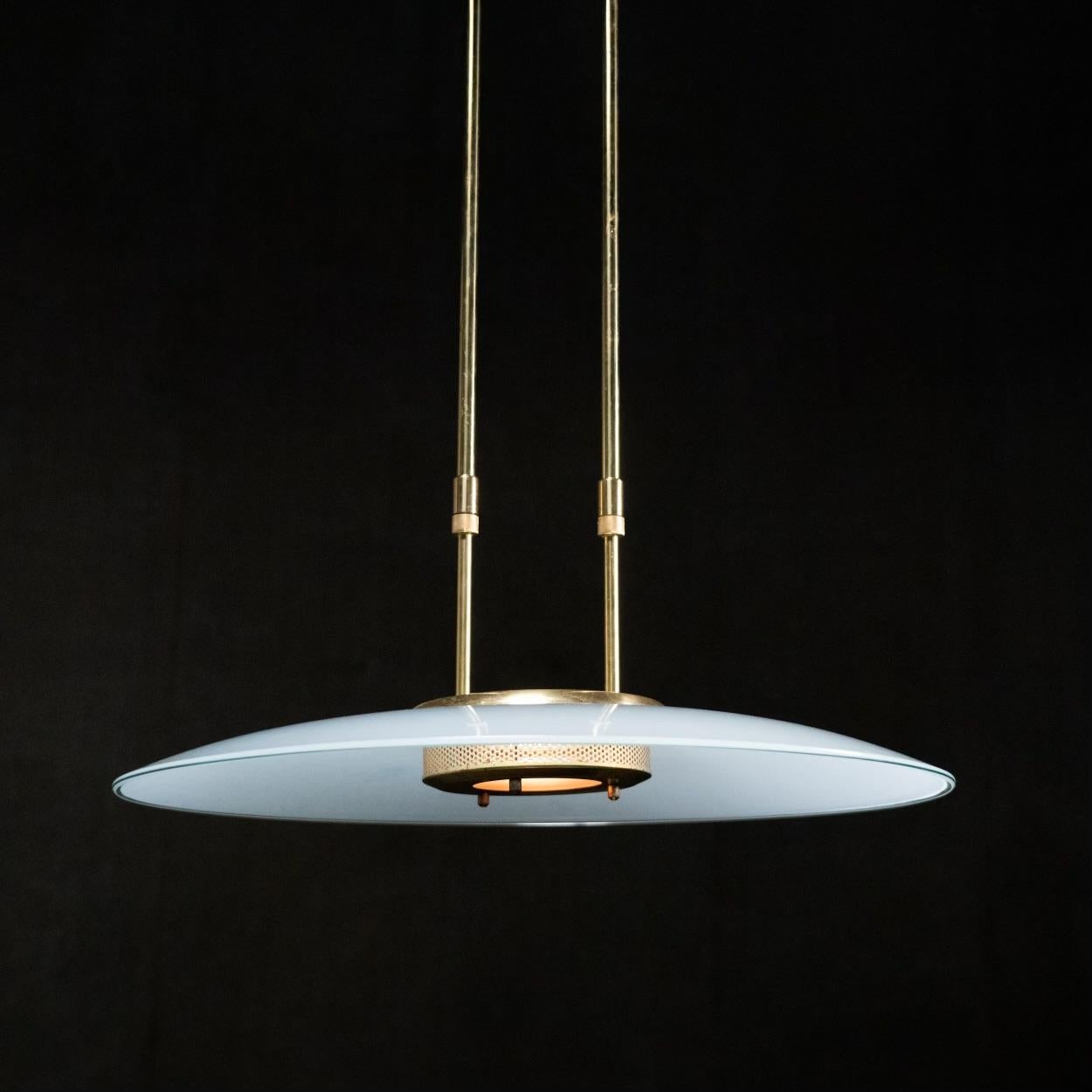 Two very unique pendants with large milk glass shade modern details with twin adjustable piping for extension or height adjustment ... movement is 28-42 with ceiling mounting plate in place..

Found in italy ..rewired and fully functional ..PRICE