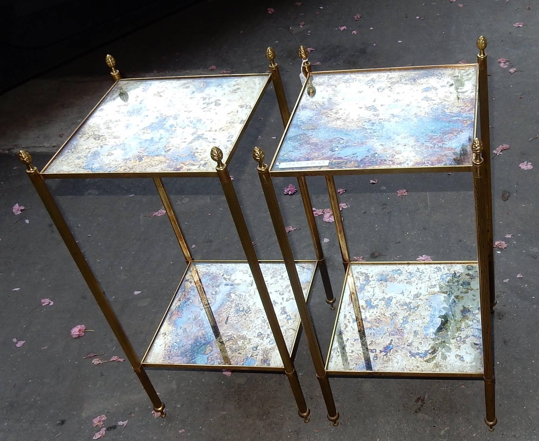 Pair of stools in brass and bronze with cone pine, in the style of Maison Bagues, top in mirror olded oxyded, circa on 1970, good condition. Measure: 32 x 32 cm.