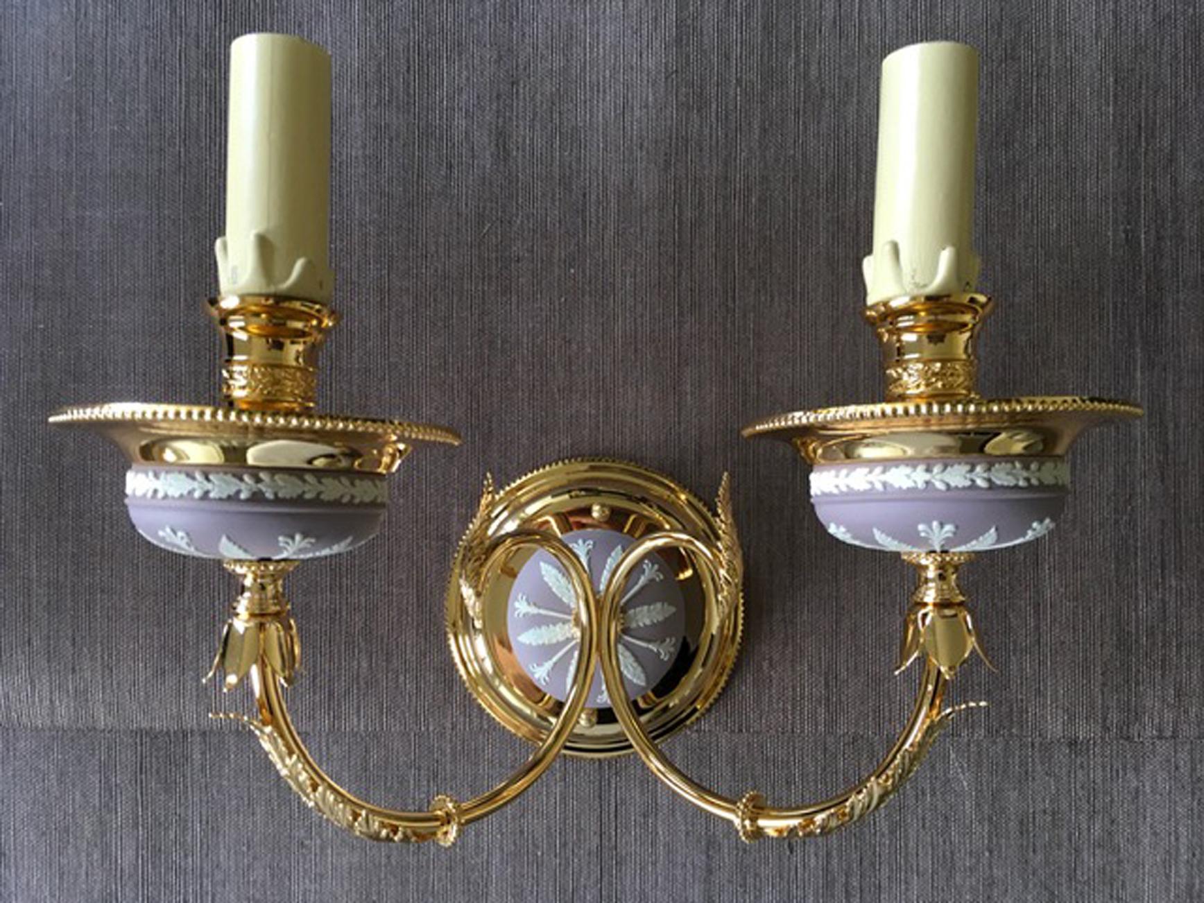 This elegant and glamourous two lights wall light in pink lilac color, it is part of the latest pieces manufactured by a well known Italian factory during the 1970' and then left  in the warehouse until today. The Greek and roman scenes have been