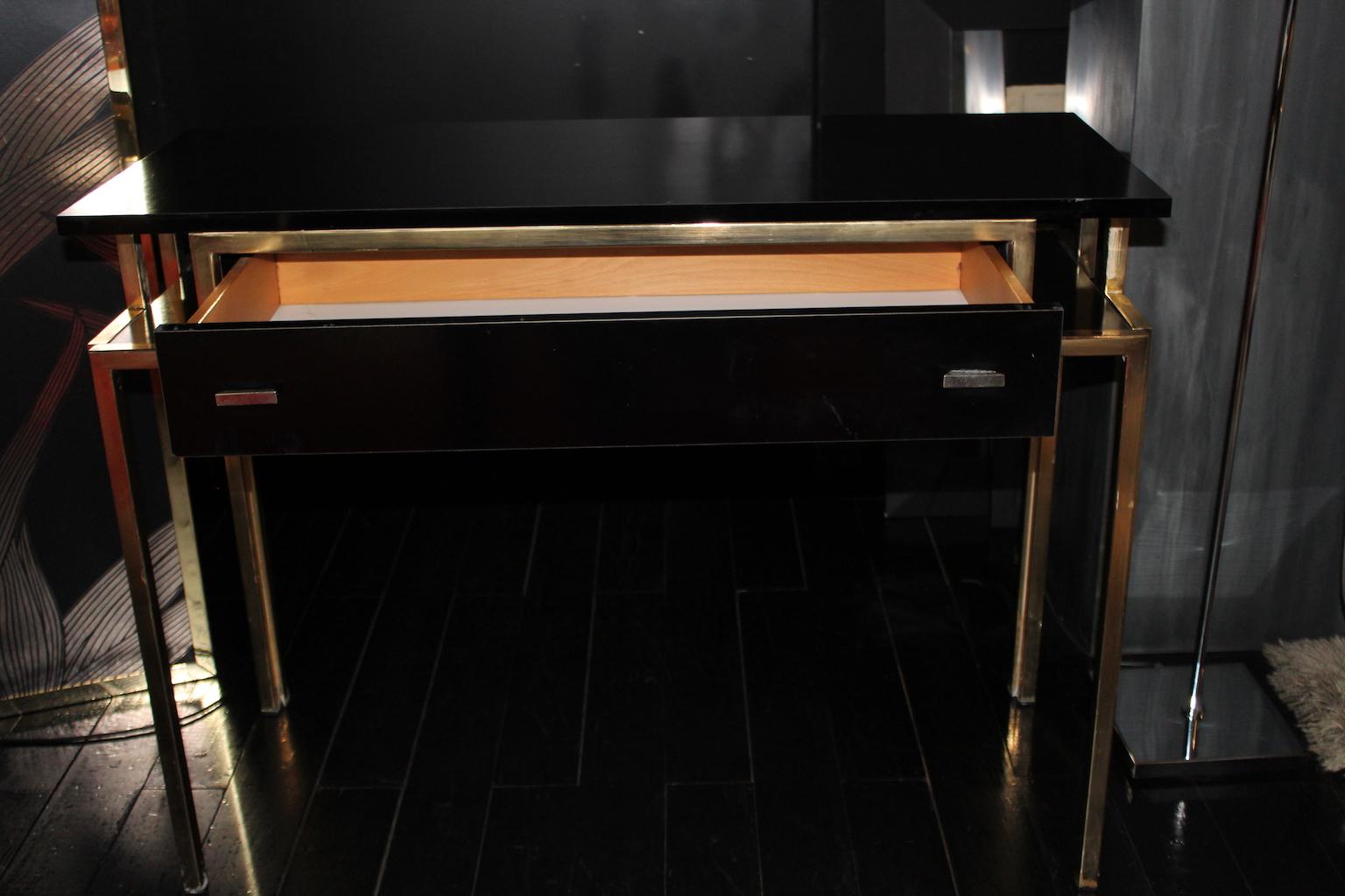 1970 rectangular writing desk / console in laminate and brass finishes.