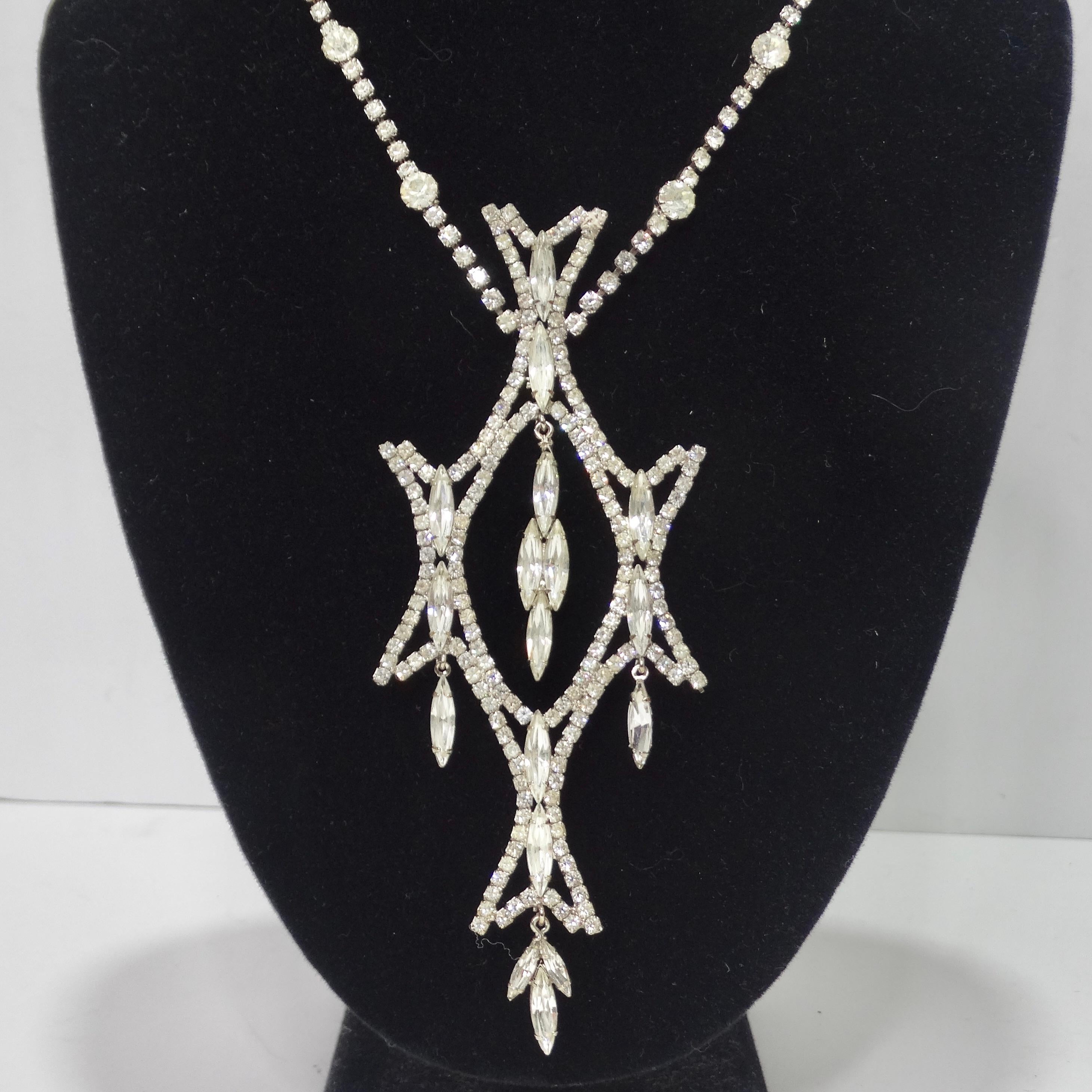 Calling all vintage jewelry lovers! This statement rhinestone necklace is begging to be added to your collection! This necklace is simply mesmerizing, the arrangement of all of the rhinestones is so intricate and comes together to create the most