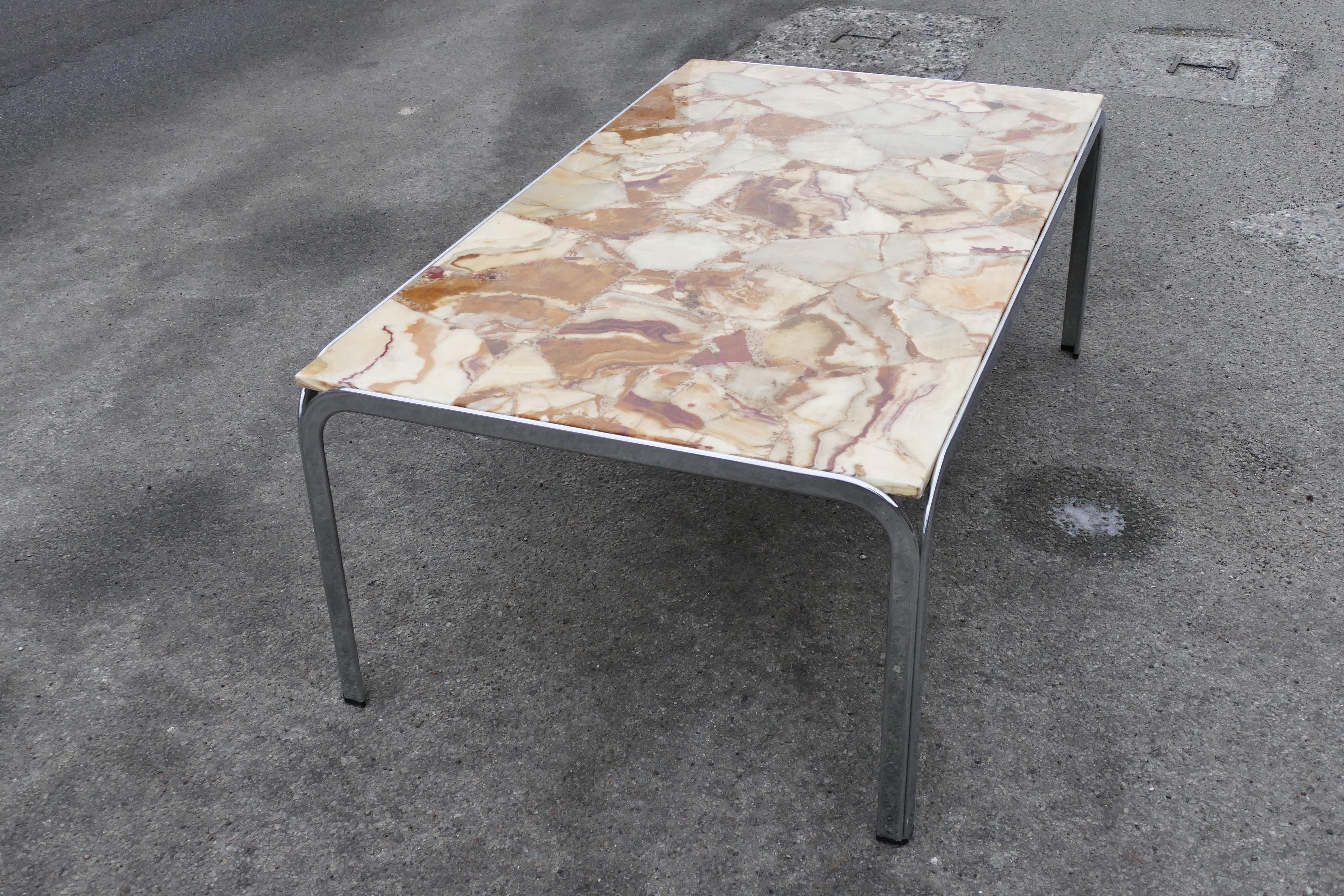 A lovely Mid-Century Modern chrome marble table with beautiful features for a special livingroom.