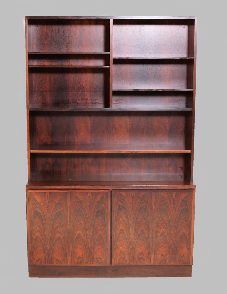 1960s-1970s rosewood shelf unit and cabinet designed and produced by Omann Jun.

The unit can be split into a cabinet unit and a shelf unit and can be combined with more units into a larger shelf unit.

The piece is well crafted in a manner that