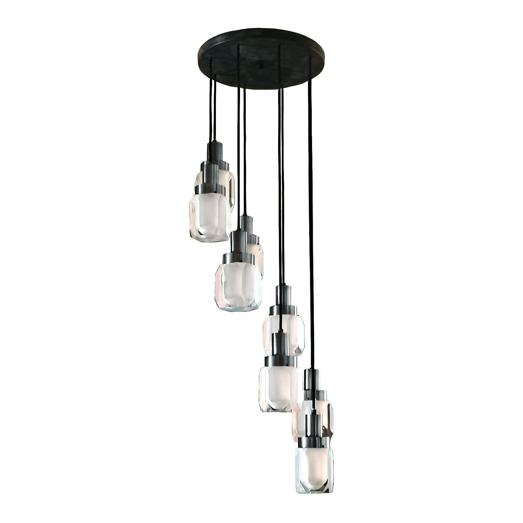 Pendant with eight lights, chrome-plated metal, black sheet metal and large thickness plexiglass. New wires and electricity.

Design: Gaetano Misaglia.

Italy circa 1970.