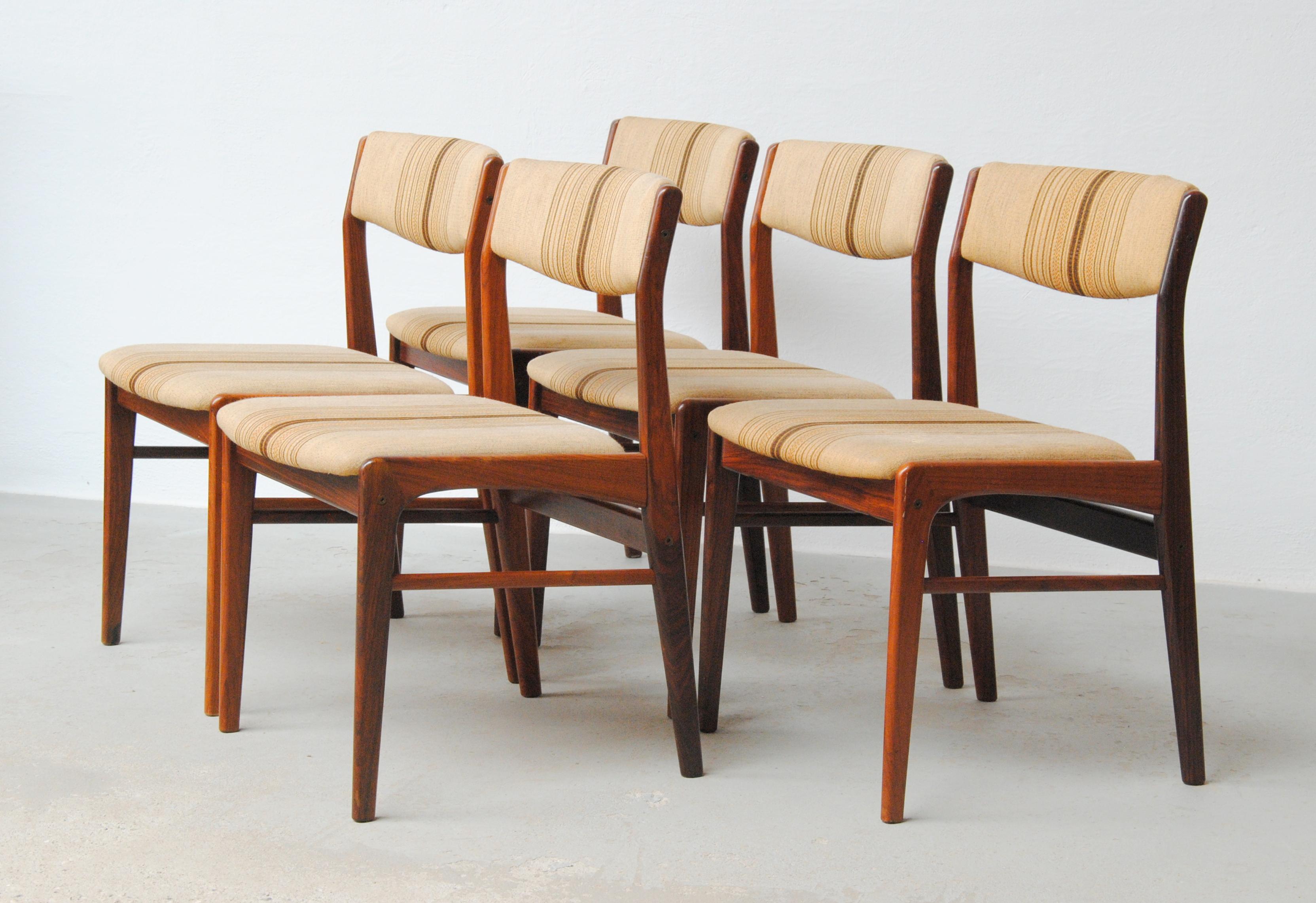 1970's Set of five restored rosewood dining chairs custom upholstery included.

The set of 5 rosewood dining chairs feature a slim minimalistic scandinavian design with small but elegant curves that give the chairs personality on top of good